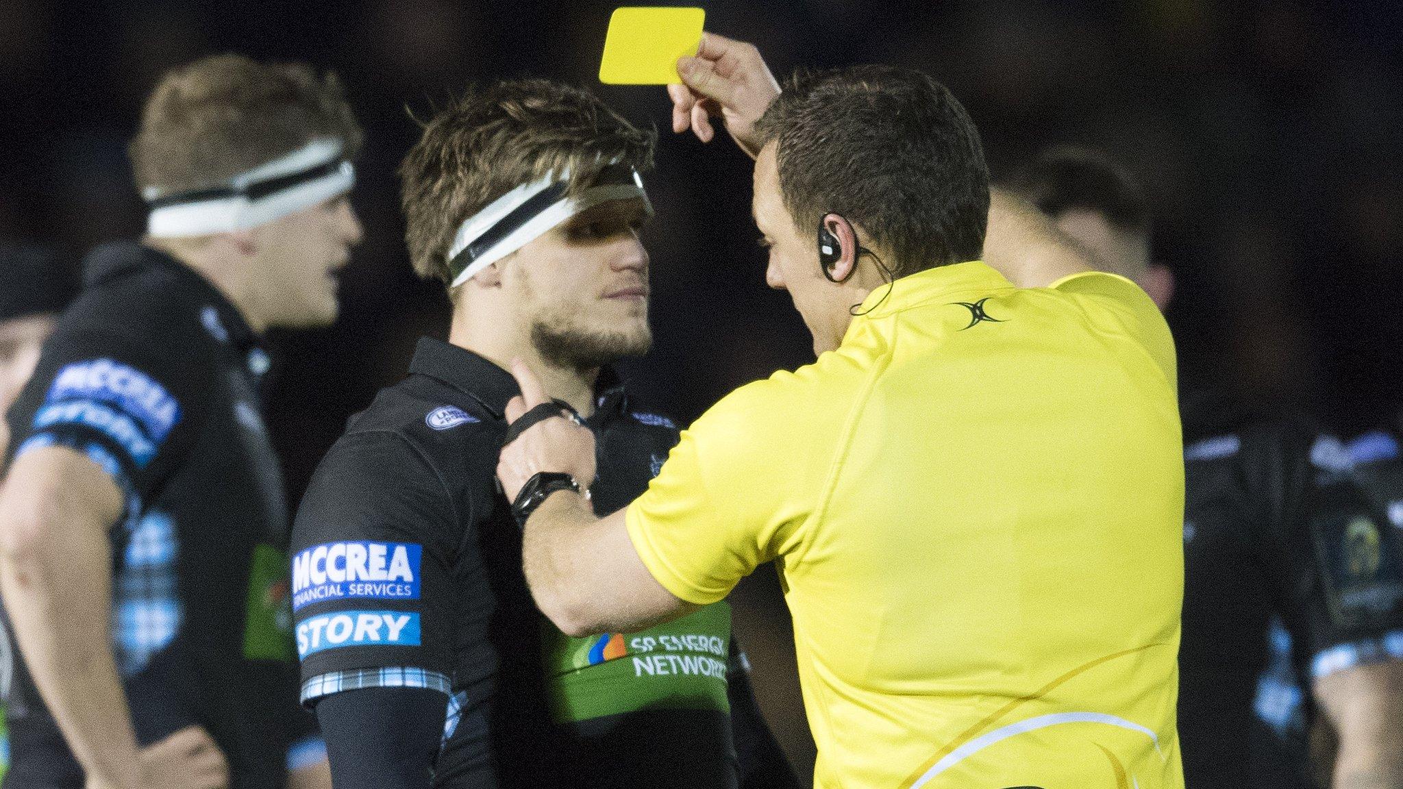 Glasgow Warriors' George Turner is shown a yellow card against Montpellier