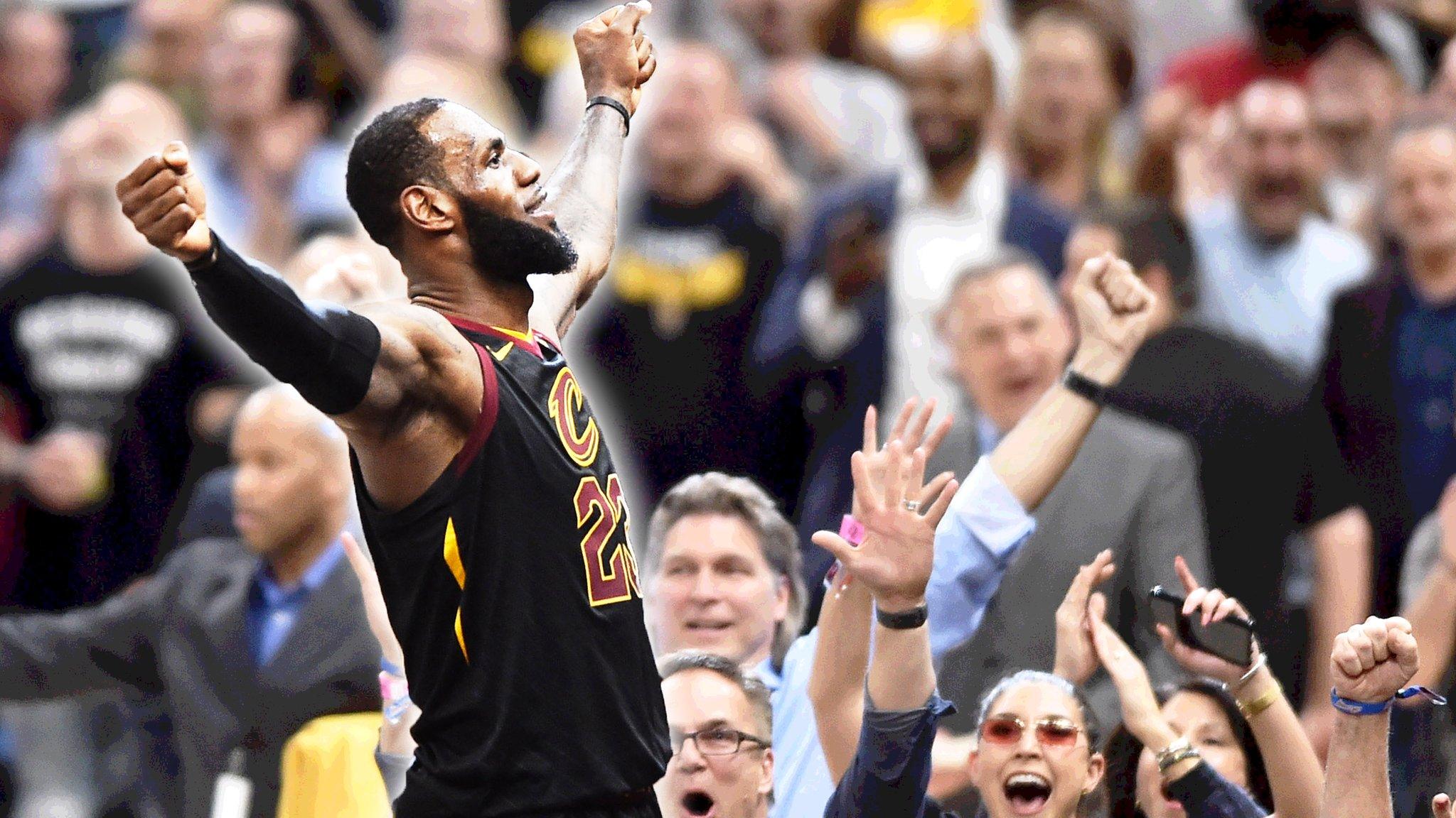 LeBron James celebrating with a crowd behind him