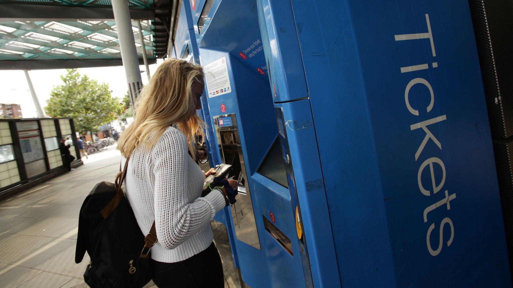 Woman buying train tickets