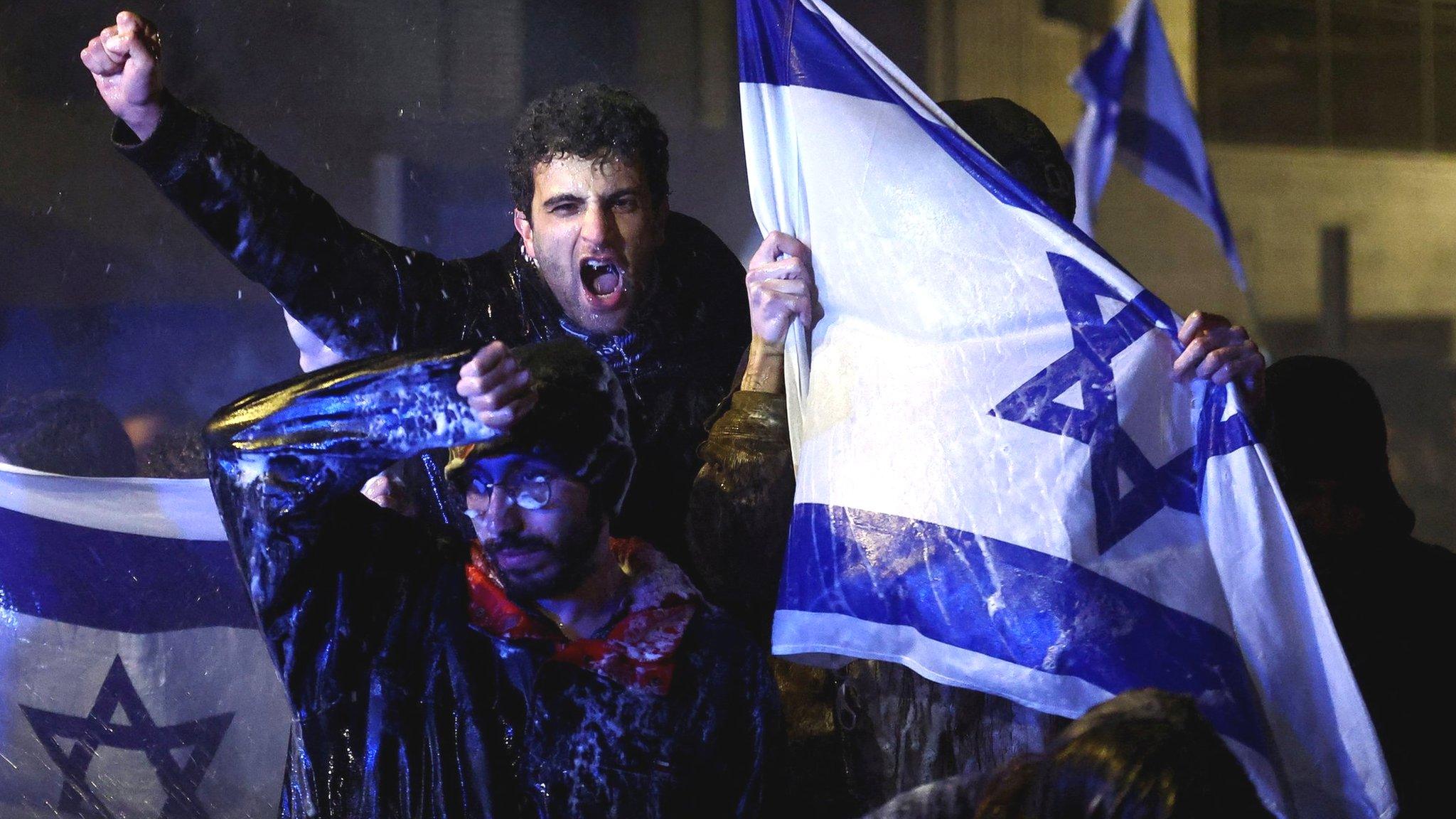 People protest against the Israeli government’s planned judicial overhaul in Jerusalem (26 March 2023)