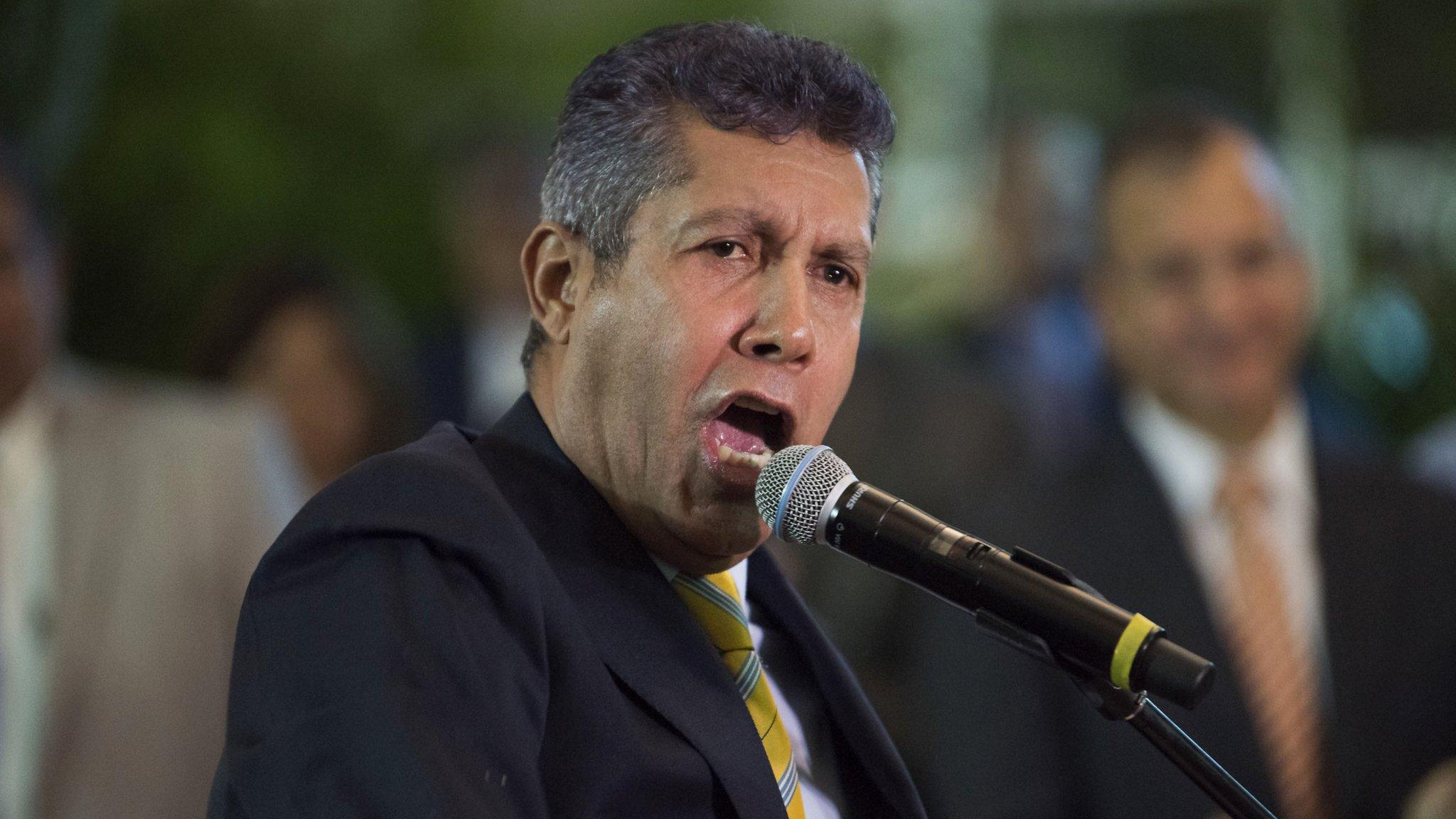 Former Lara governor Henri Falcon addresses the media after submitting his presidential application in Caracas on February 27, 2018