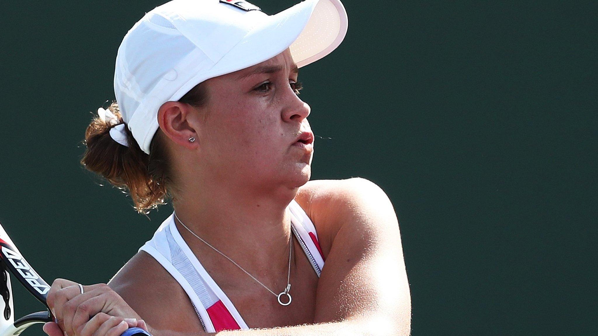 Ashleigh Barty returns a shot