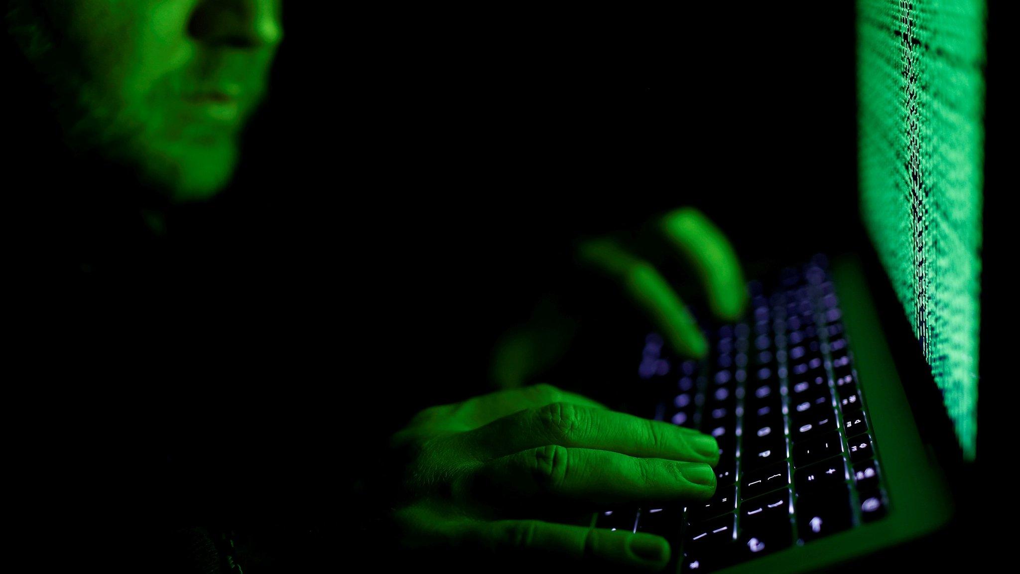 File image of a man using a computer keyboard