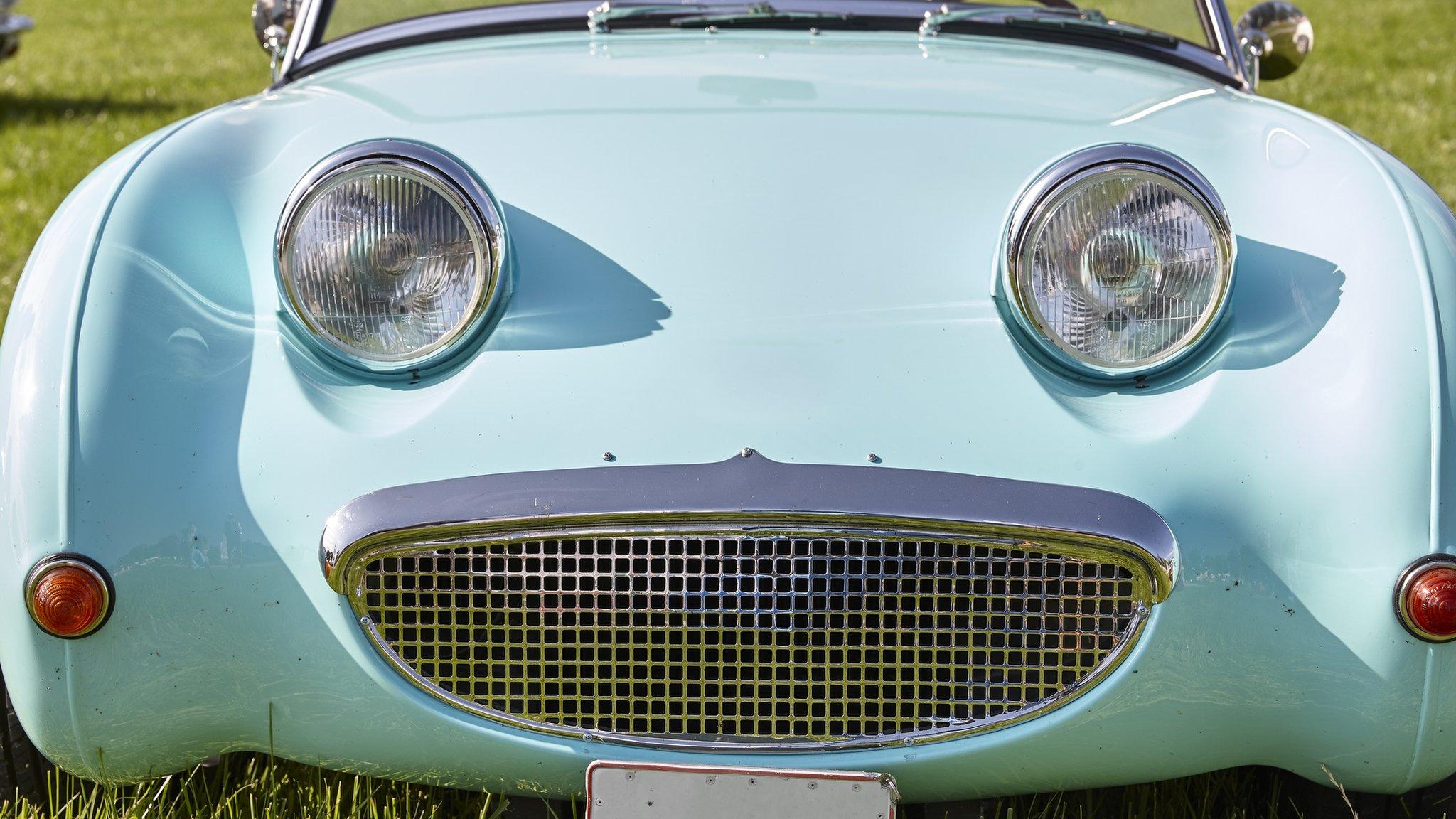 blue car that looks like a face