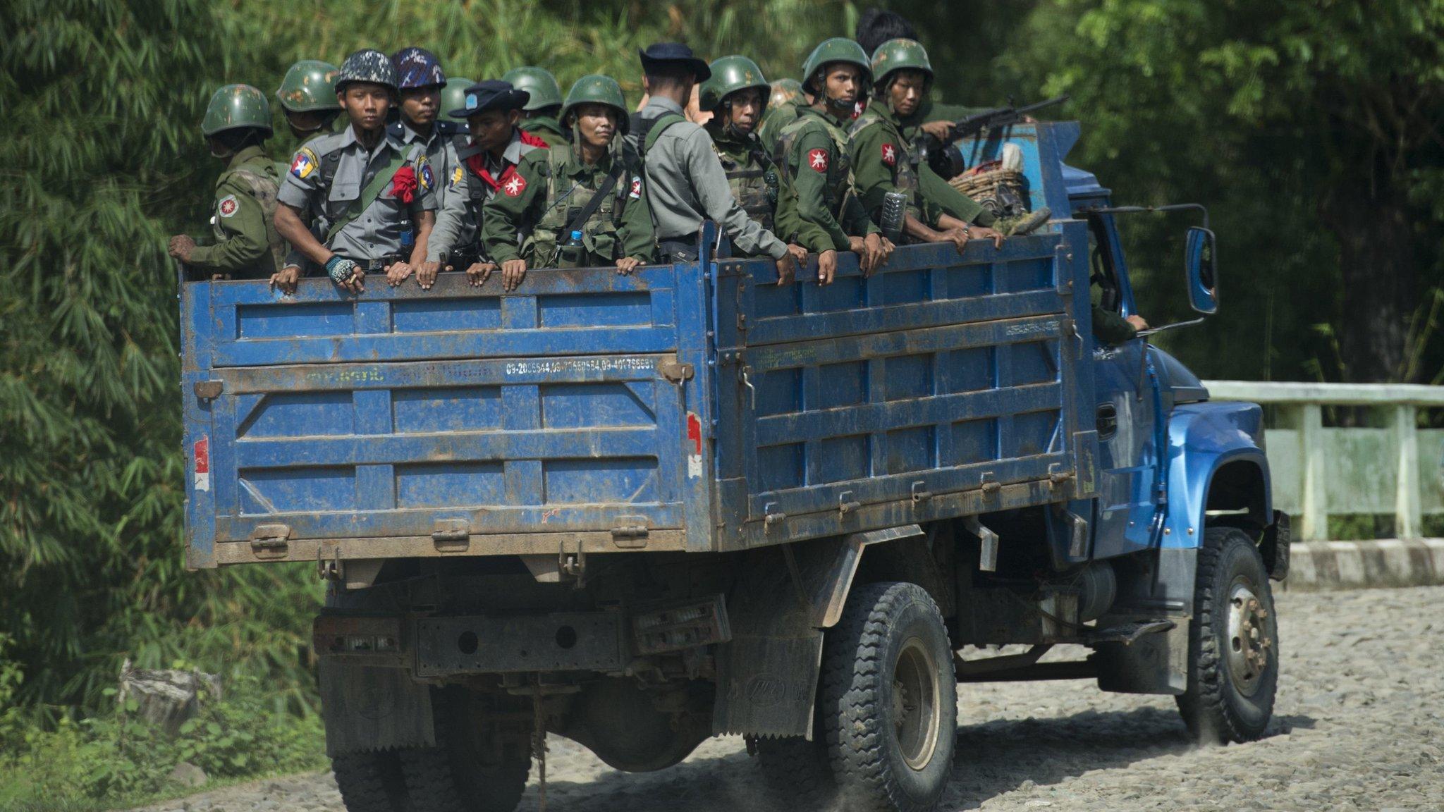 Fle image taken on 14 October 2016 shows armed military troops and police travelling in trucks through Rakhine State, Myanmar