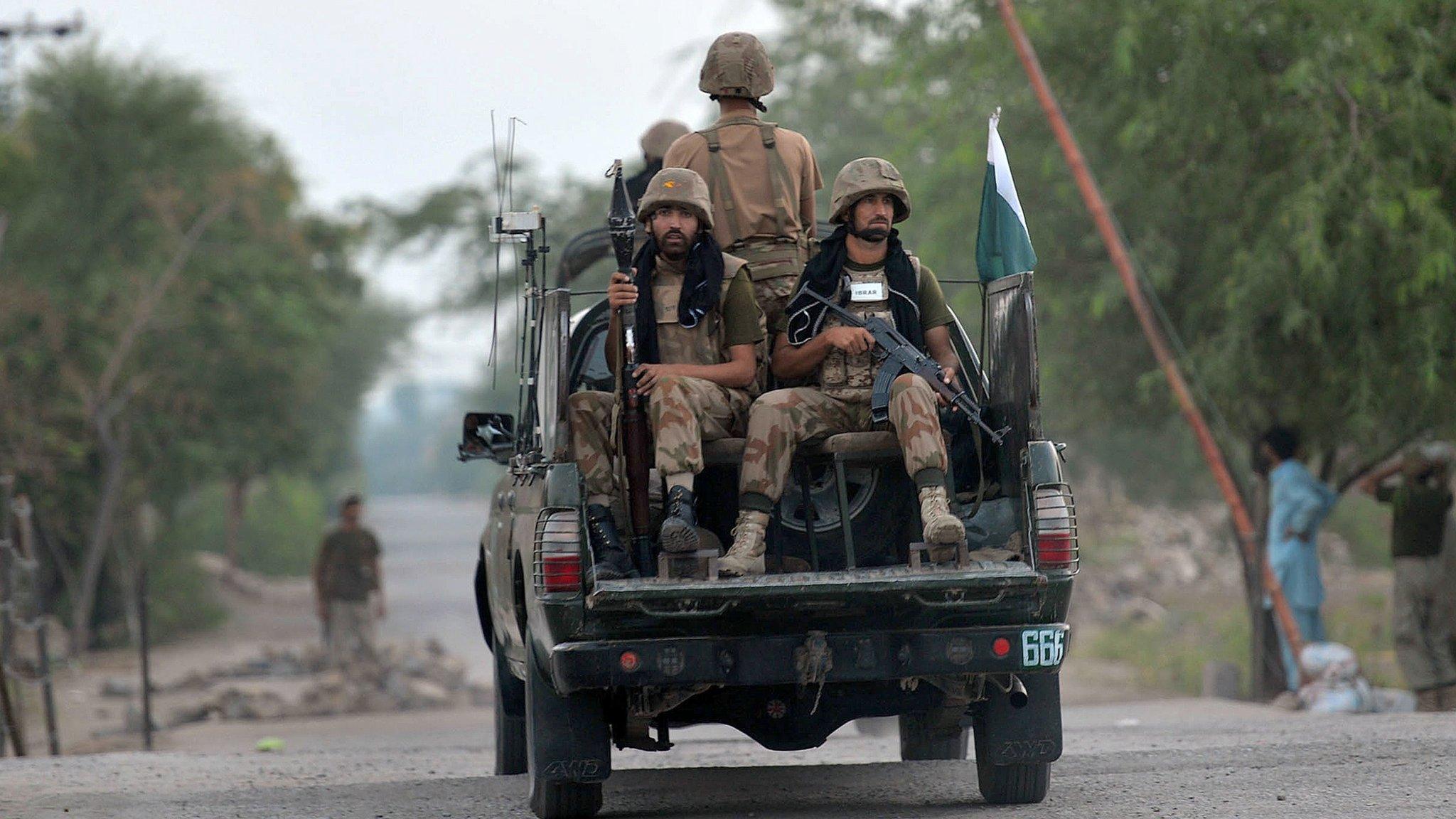 Pakistani troops patrol in the village of Ghundai in Khyber tribal district on July 18, 2014