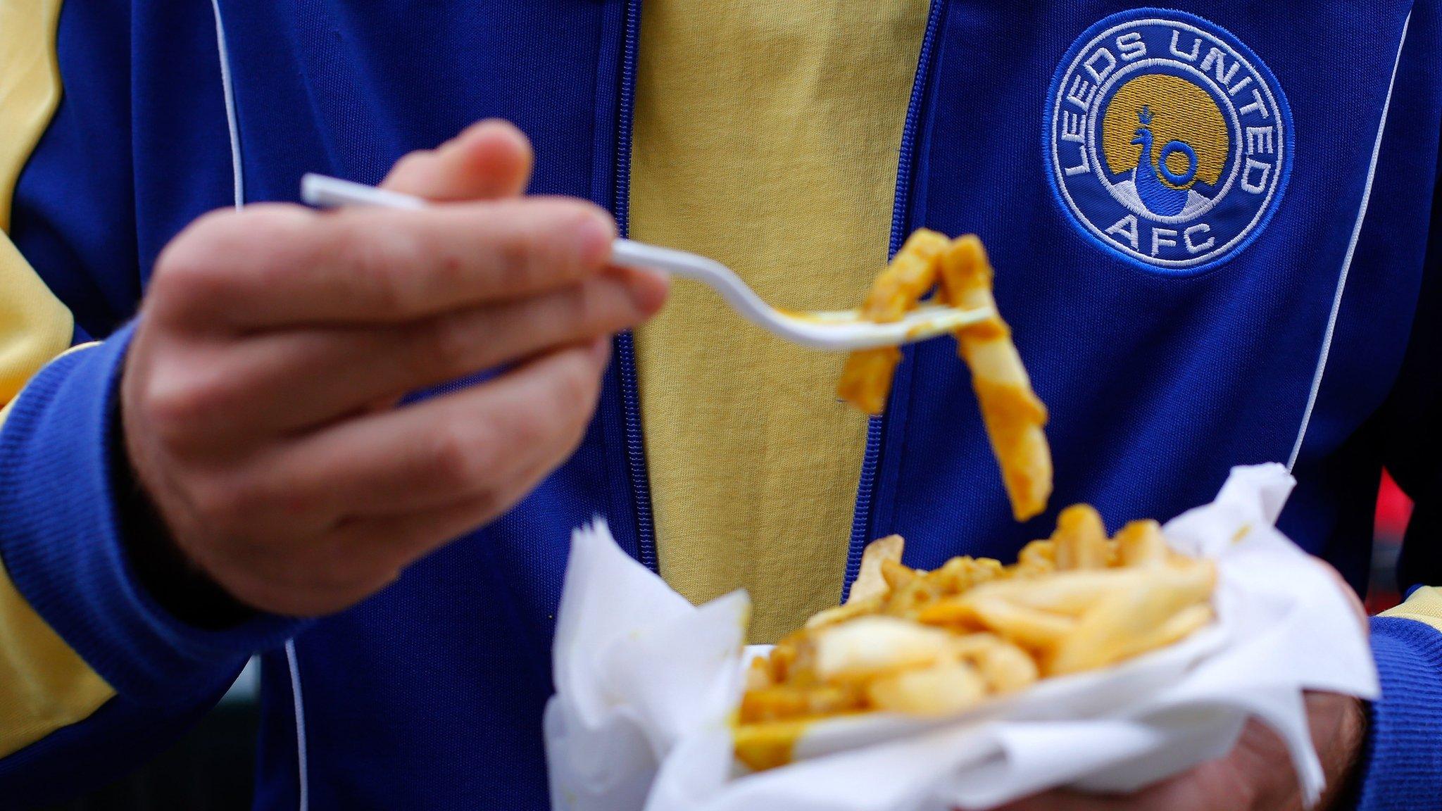 Leeds United fan eats chips