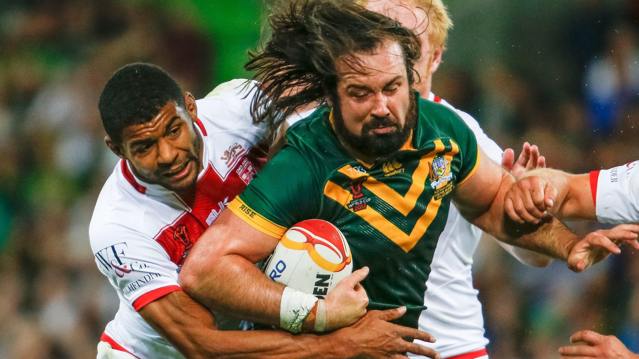 Aaron Woods tries to avoid a tackle from Kallum Watkins