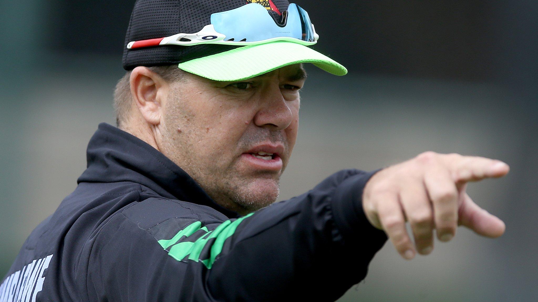Heath Streak helps Zimbabwe with some catching practice during the World Cup Qualifier in March