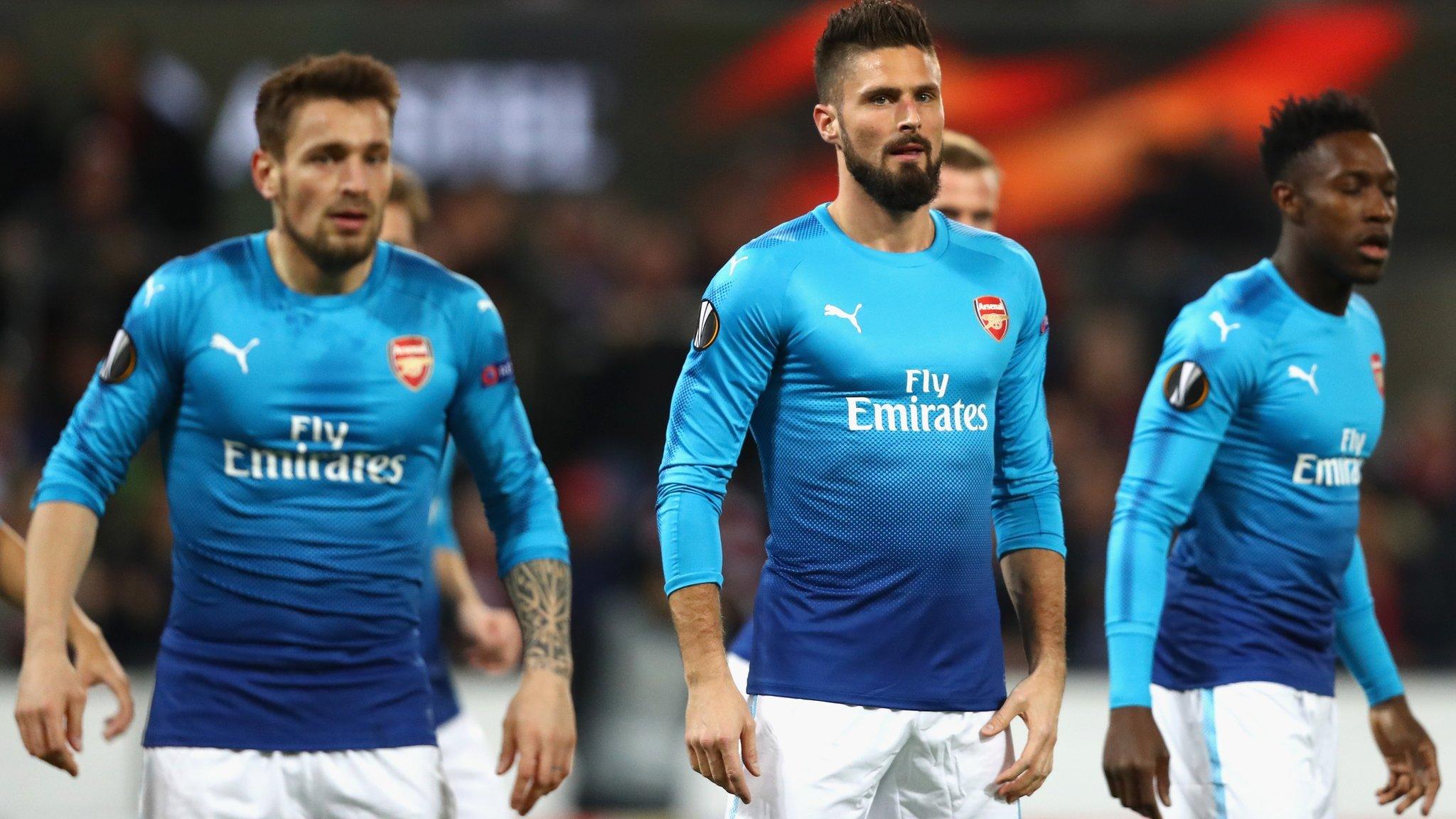 Arsenal's players react after falling behind to Cologne in the Europa League