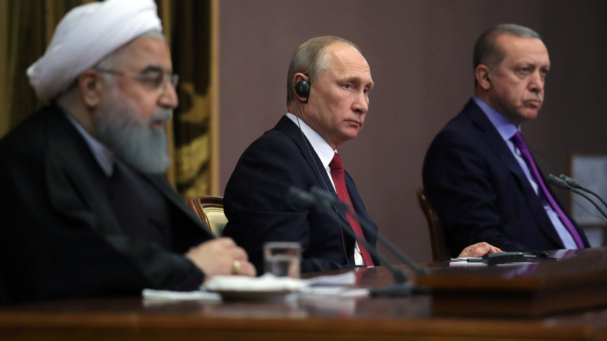 Russian President Vladimir Putin flanked by Iranian President Hassan Rouhani (L) and Turkish President Recep Tayyip Erdogan (R) in Sochi, Russia, 22 November 2017