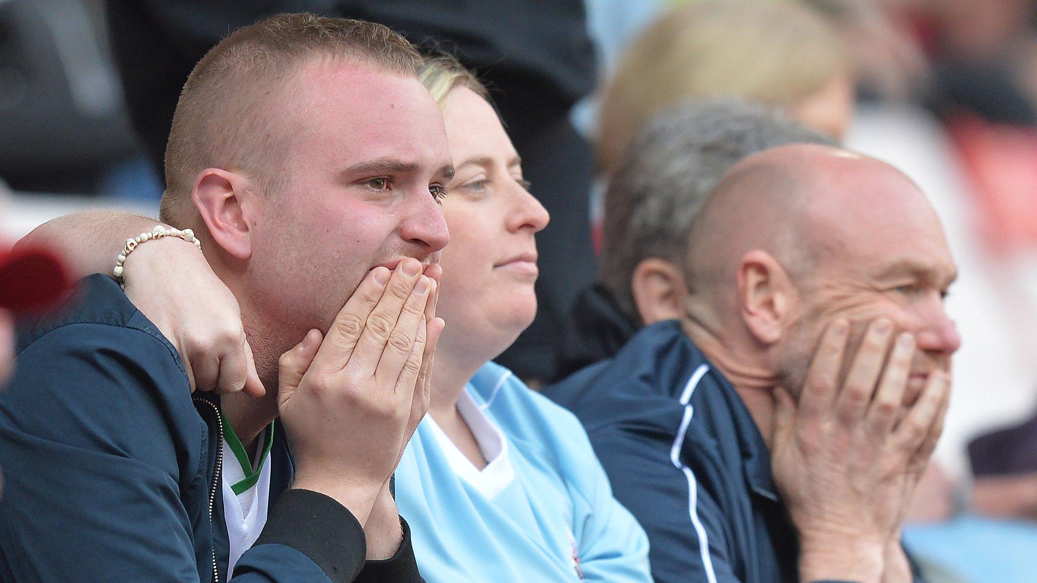 Sunderland fans watch their team relegated