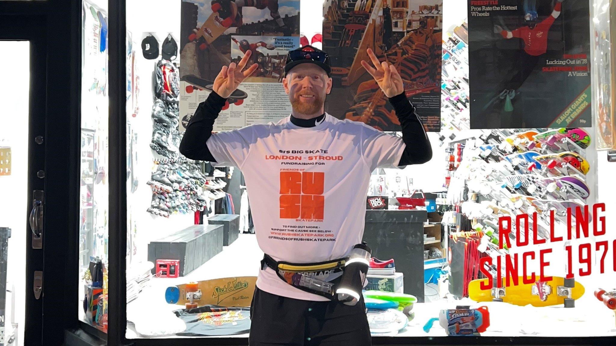 Mr Coburn stands outside the London skateshop, ready to start his journey