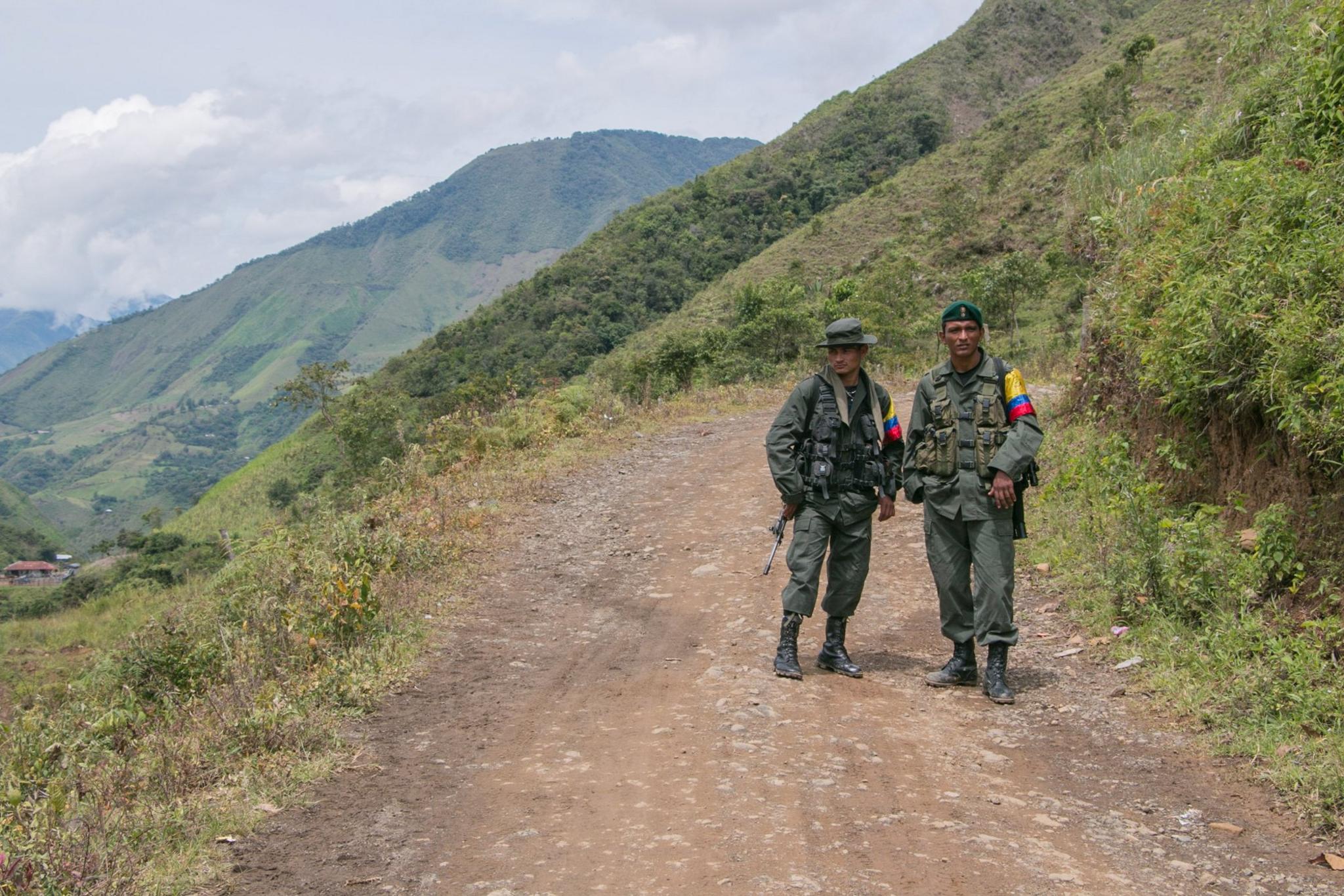 Two Farc fighters await the arrival of their commander. Santa Lucia, 2016