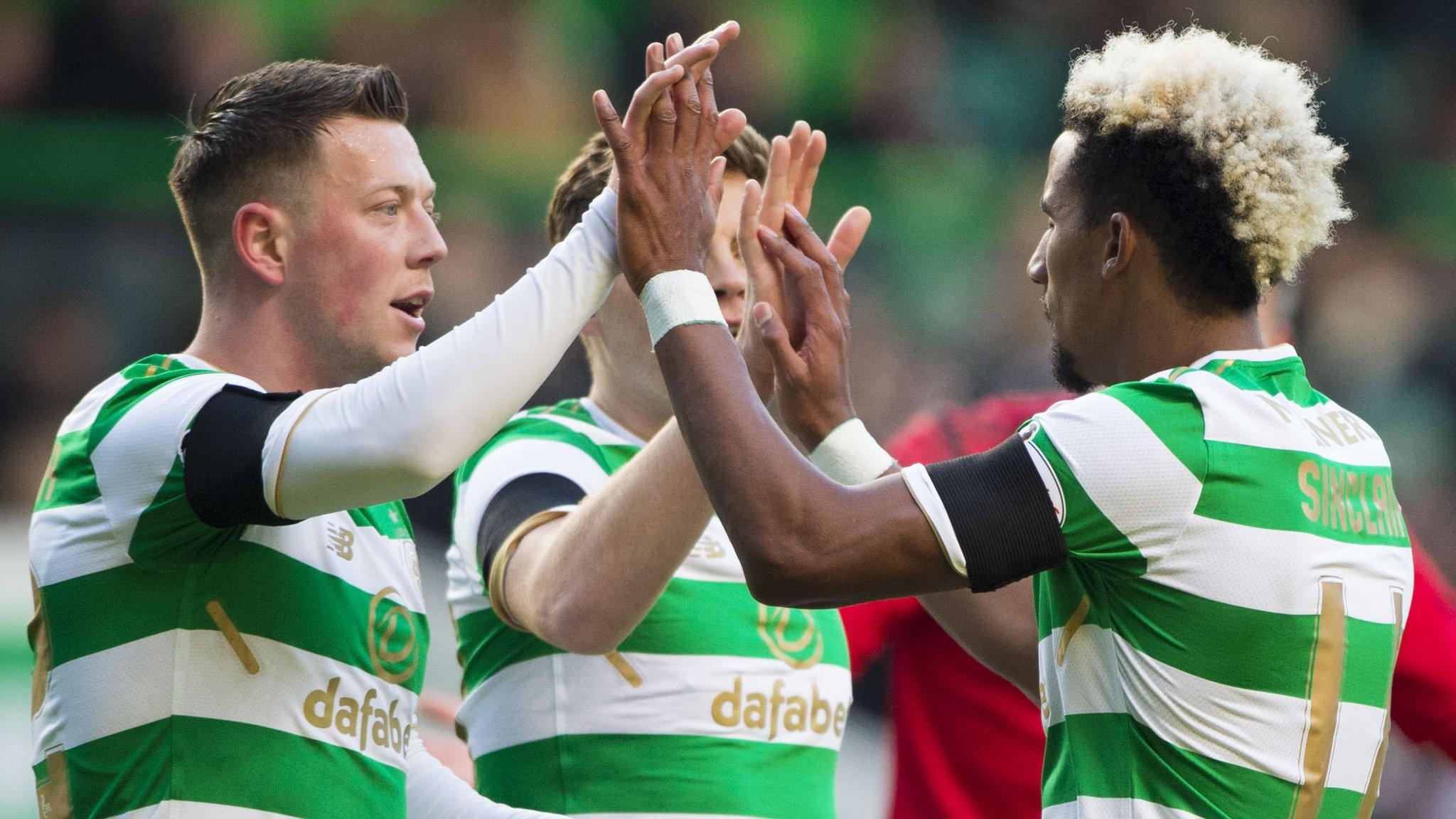 Callum McGregor helps Scott Sinclair celebrate his goal