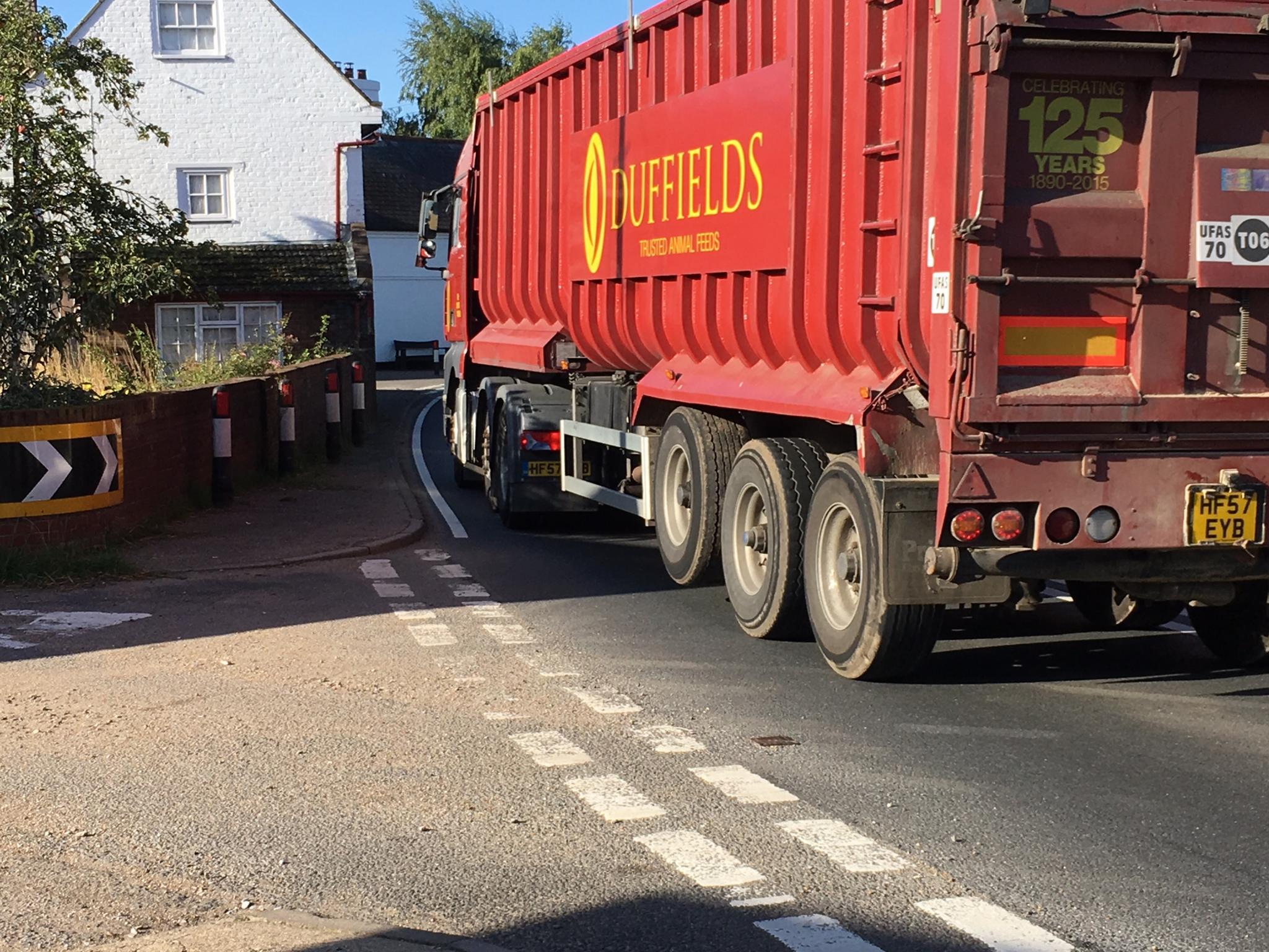 HGV lorry driving through village on single carriageway of A12