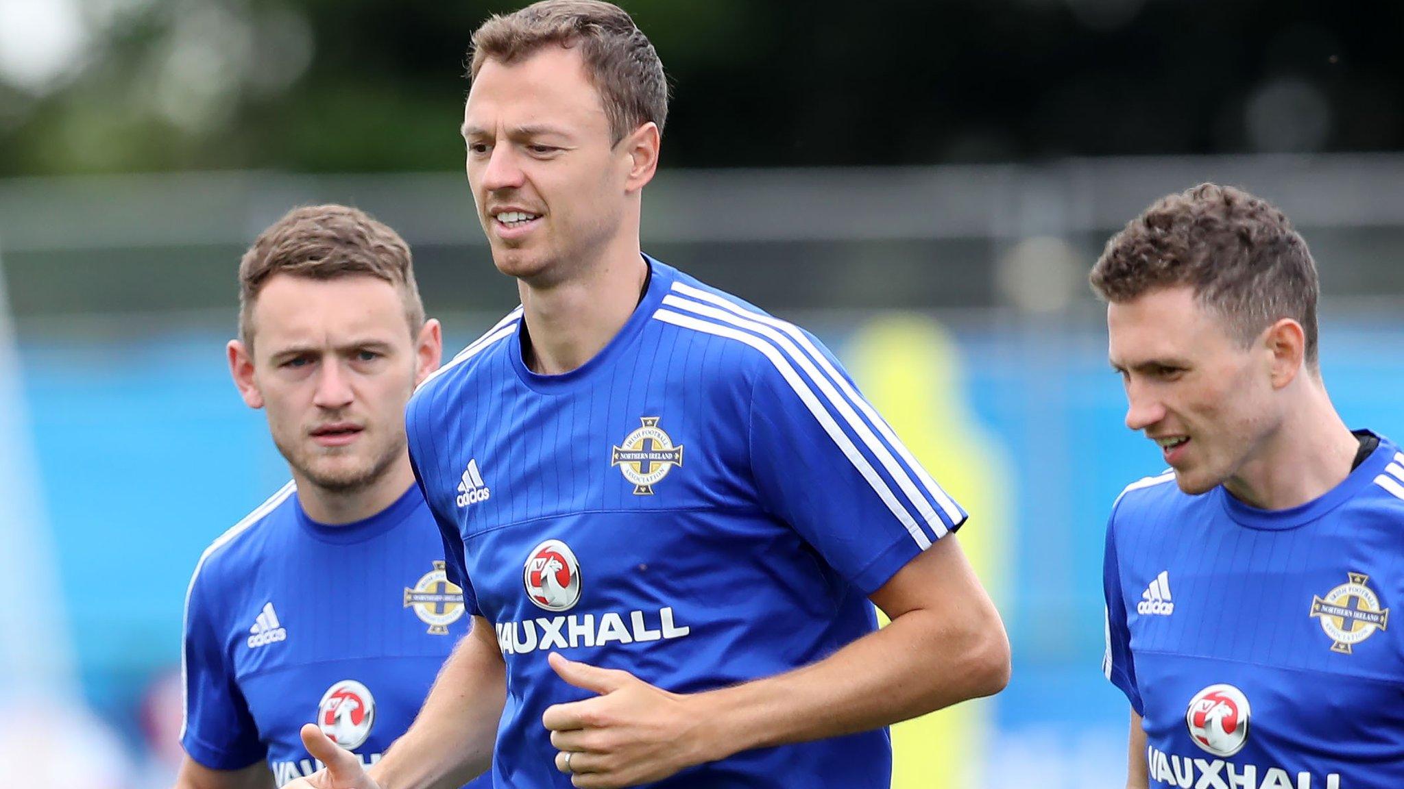 Jonny Evans leads the way in training on Tuesday morning