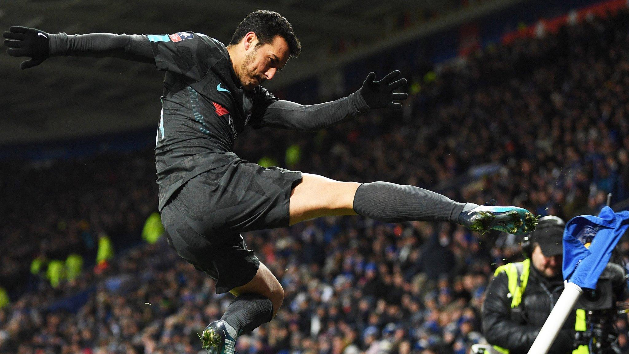 Pedro of Chelsea kicks the corner flag as he celebrates scoring their second goal during The Emirates FA Cup Quarter Final match between Leicester City and Chelsea at The King Power Stadium on March 18, 2018 in Leicester, England.