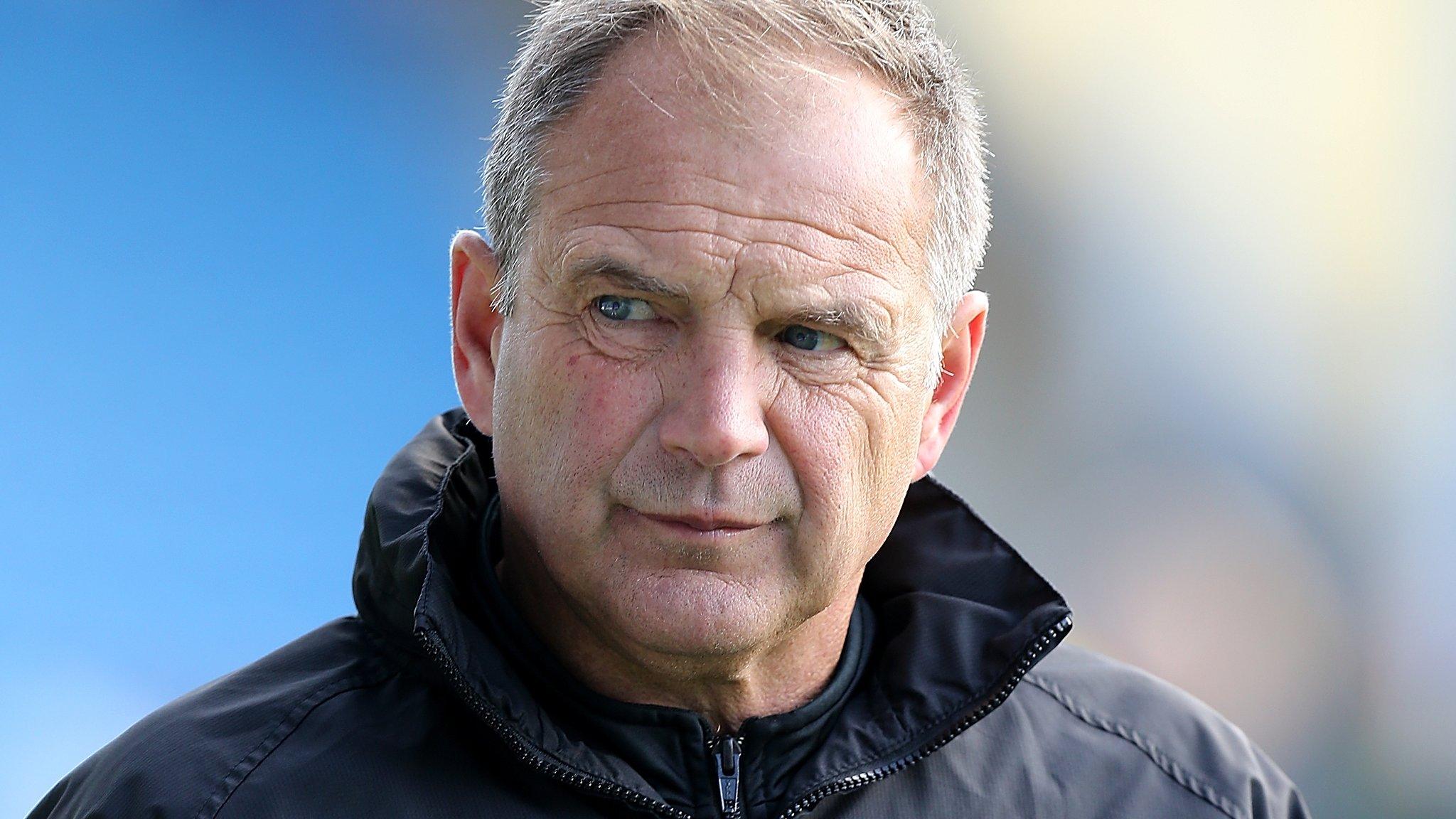 Gillingham boss Steve Lovell looks on from the sidelines