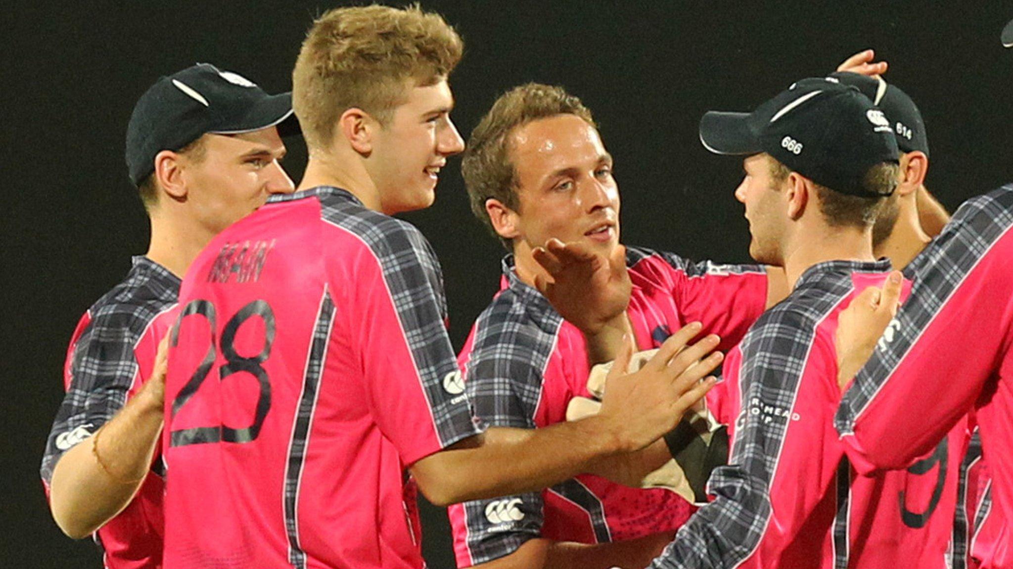 Scotland players celebrate a wicket