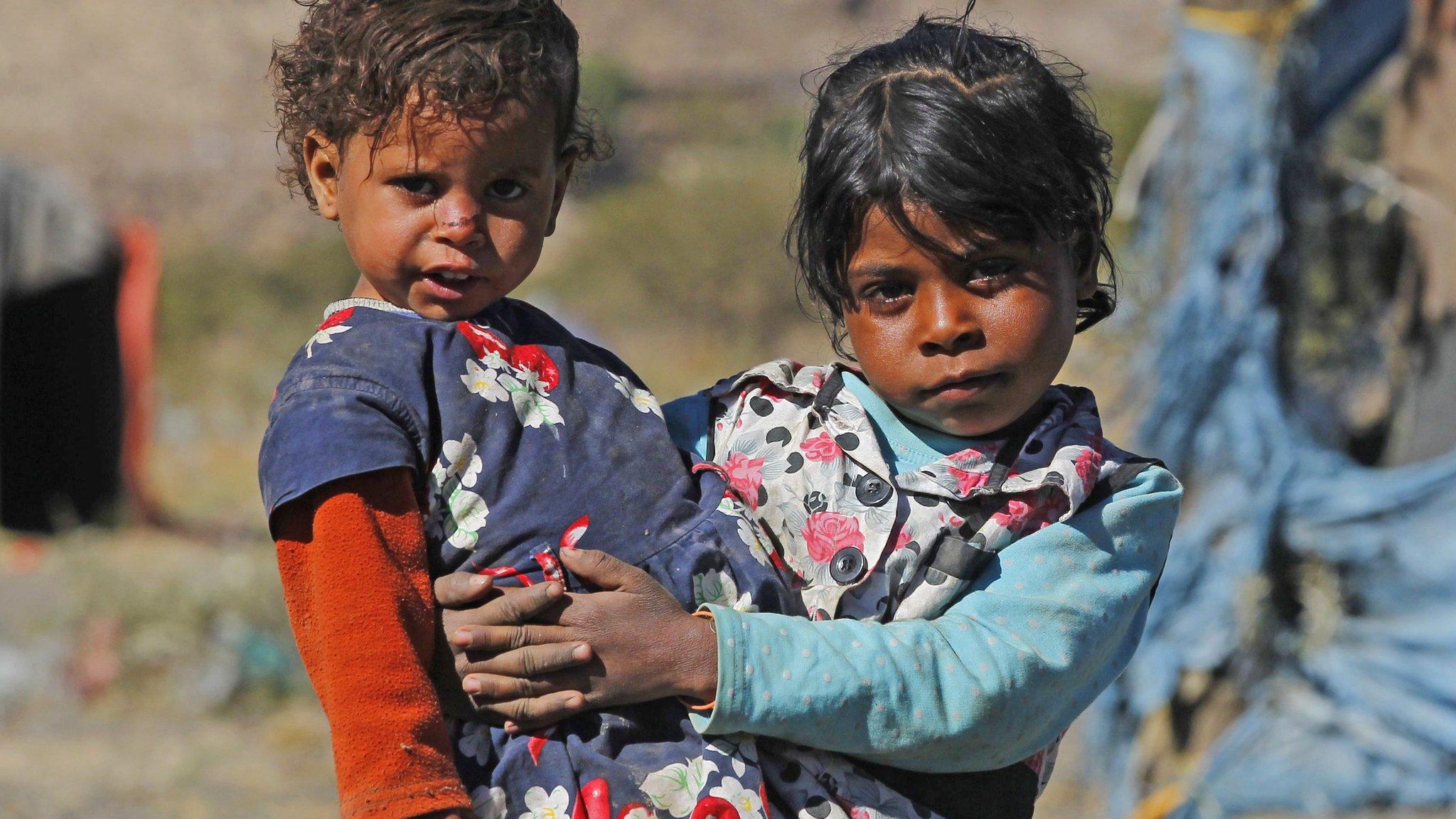 Refugee-girl-and-her-sister.