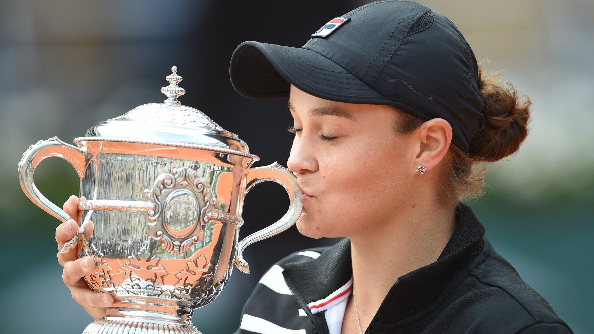 Paris, France, 8 June: Ashleigh Barty of Australia kisses the trophy as she celebrates victory following the ladies singles final against Marketa Vondrousova of The Czech Republic during Day fourteen of the 2019 French Open at Roland Garros. (Photo by Stephane Cardinale/Getty Images)