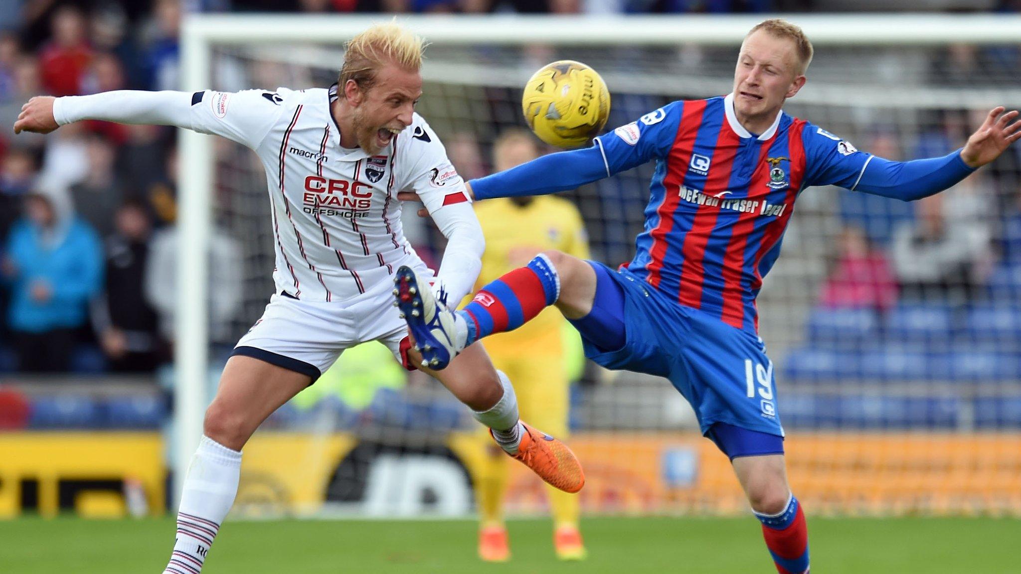 Ross County's Andrew Davies (left) and Inverness CT's Scott Boden in action