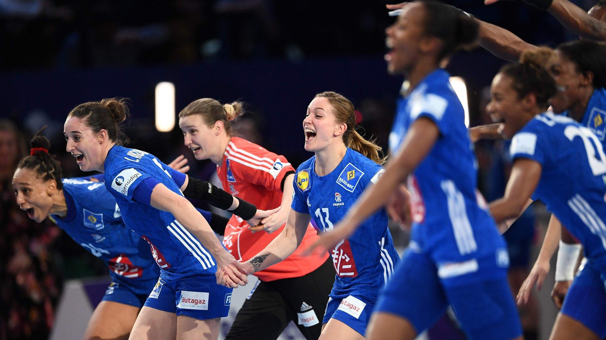 France's players celebrate after winning the EHF European Women's Championship against Russia at the AccorHotels Arena in Paris. (Photo by Anne-Christine/AFP/Getty Images)