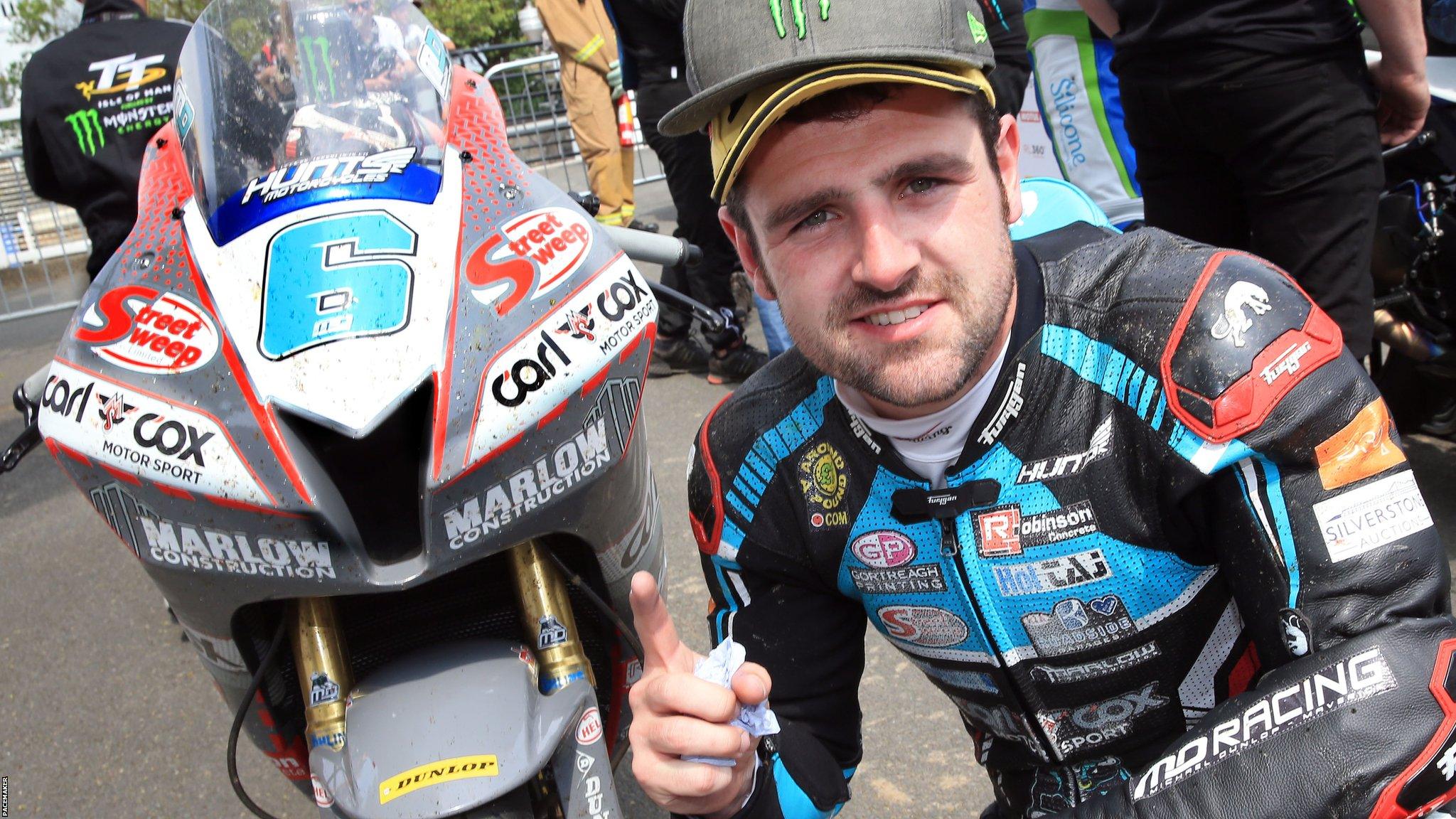 Michael Dunlop celebrates the Supersport win which was his 27th podium finish in 40 Isle of Man TT races