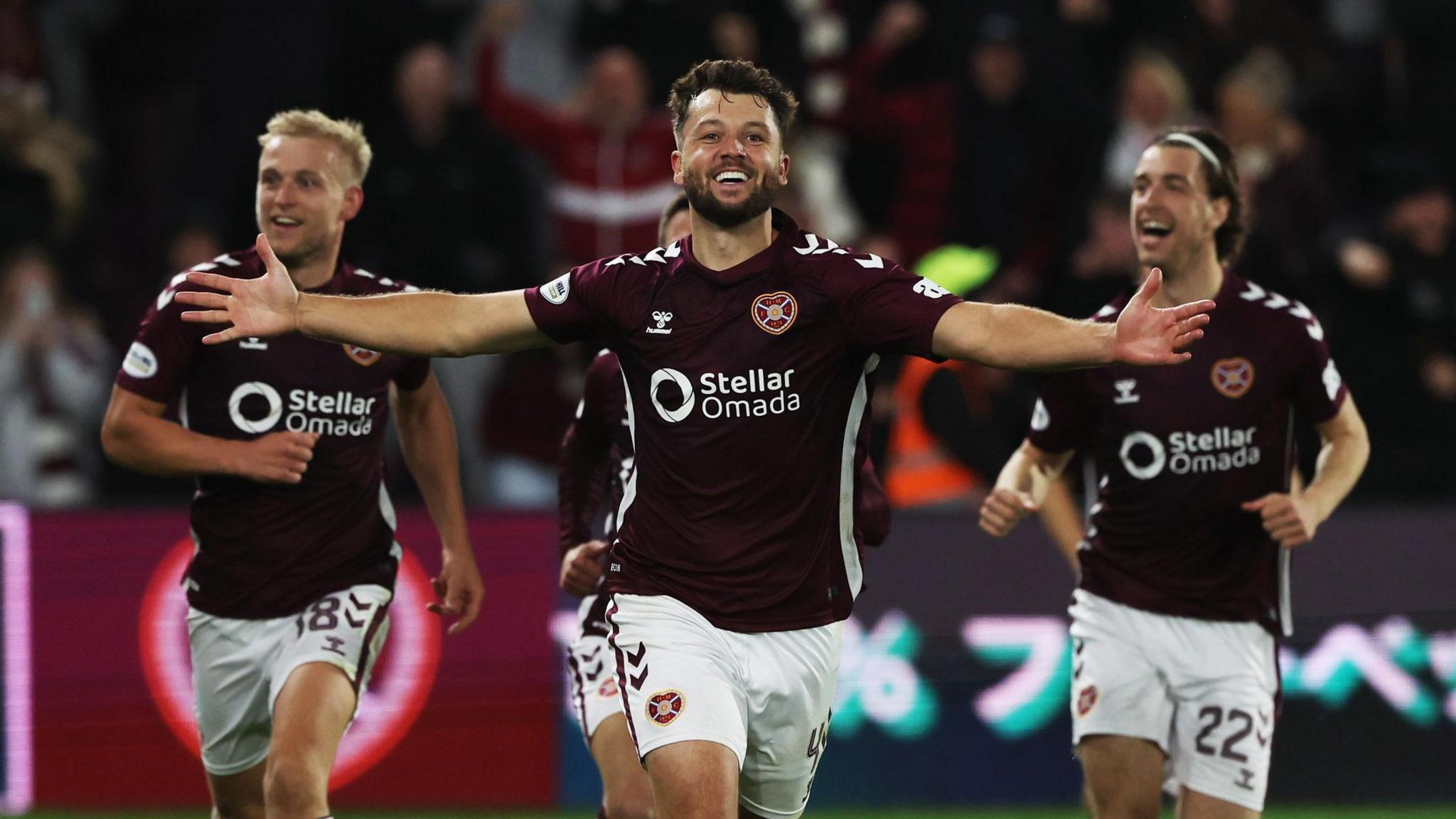 Craig Halkett celebrates