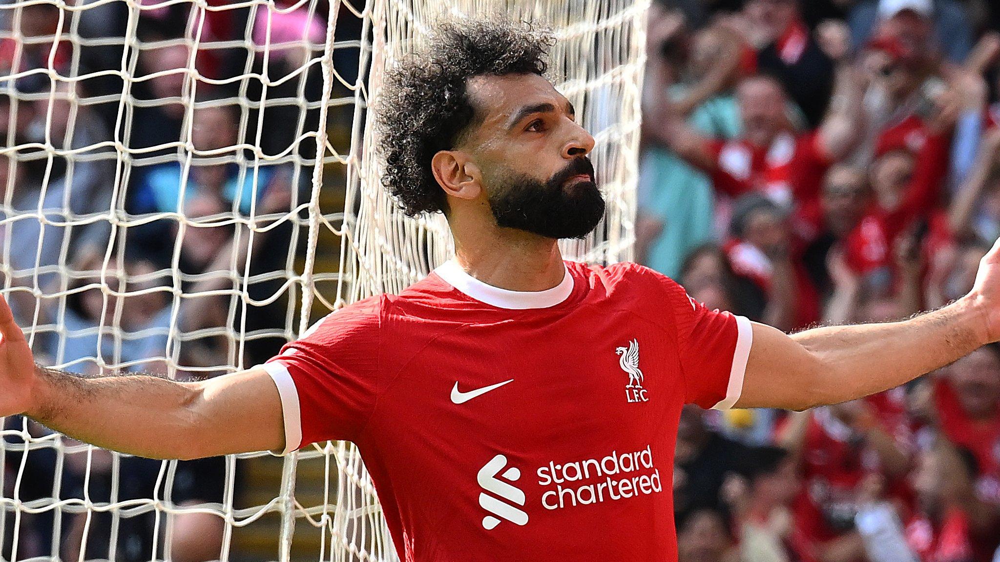 Mohamed Salah celebrates scoring against Tottenham Hotspur at Anfield