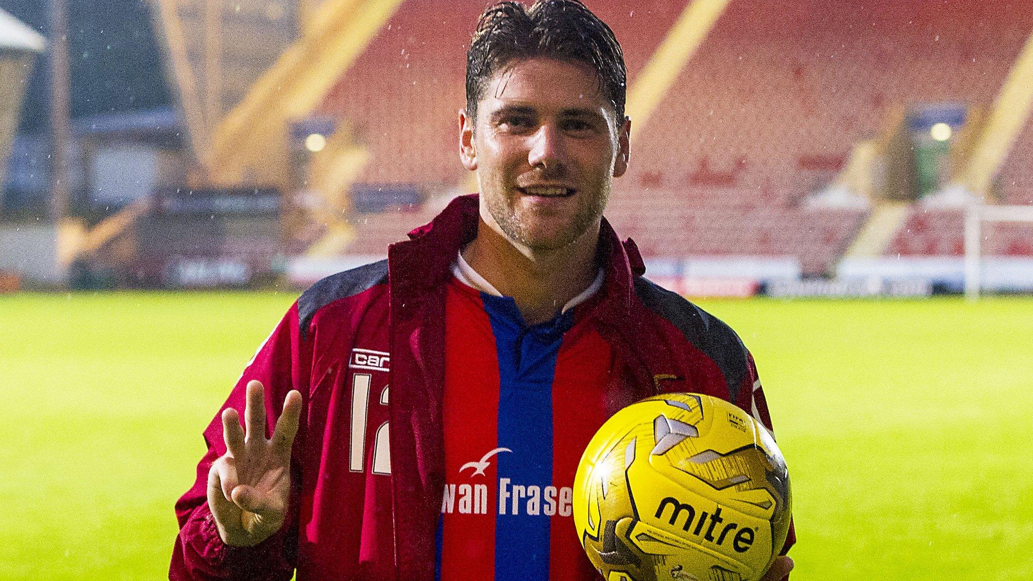 Inverness midfielder Iain Vigurs celebrates with the match ball after his hat-trick at Dunfermline