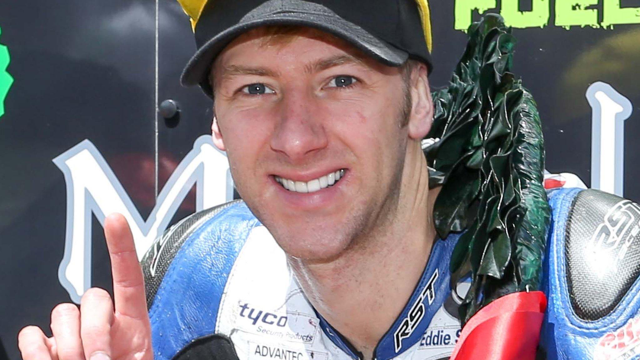 Ian Hutchinson celebrates his Superstock TT victory on Wednesday