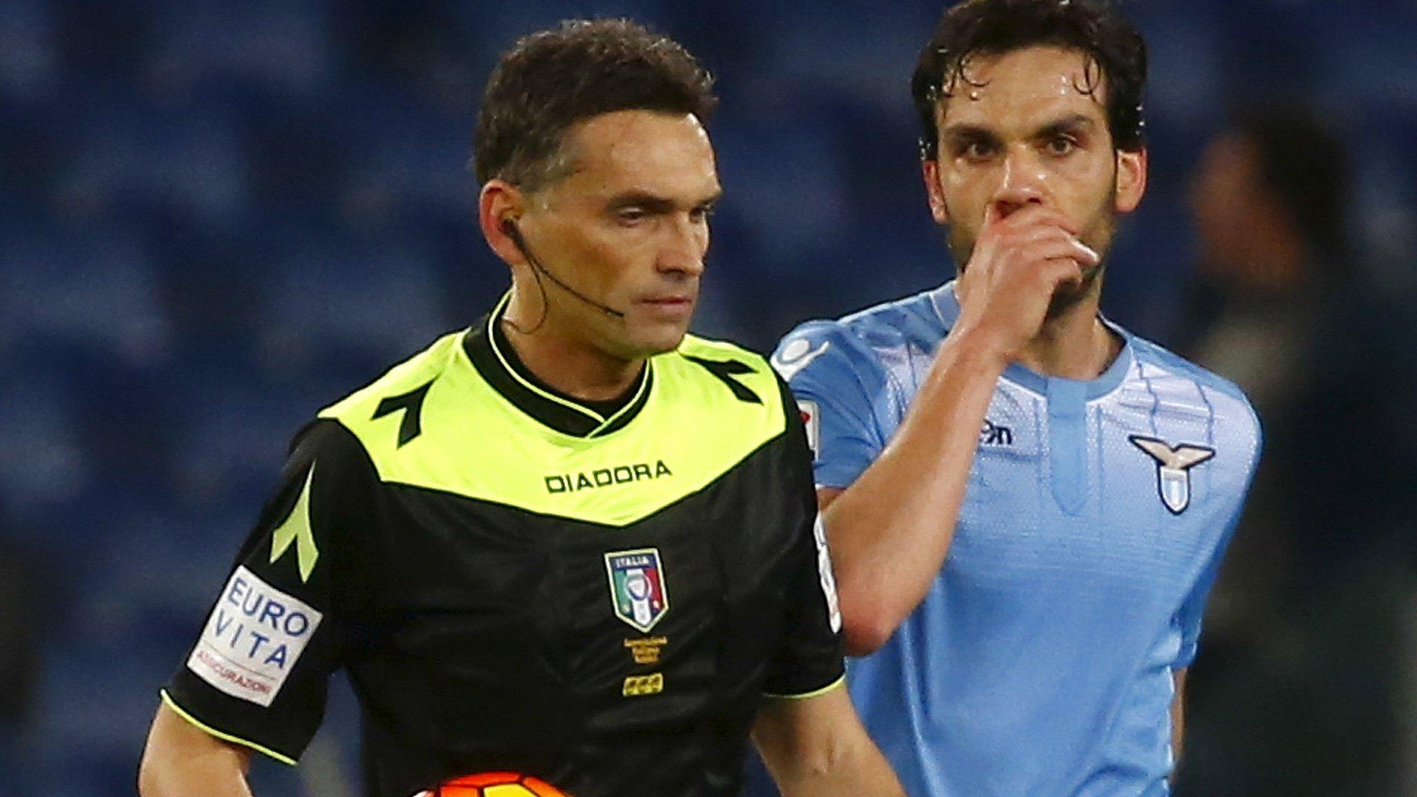 Referee Massimiliano Irrati halts the match at Lazio