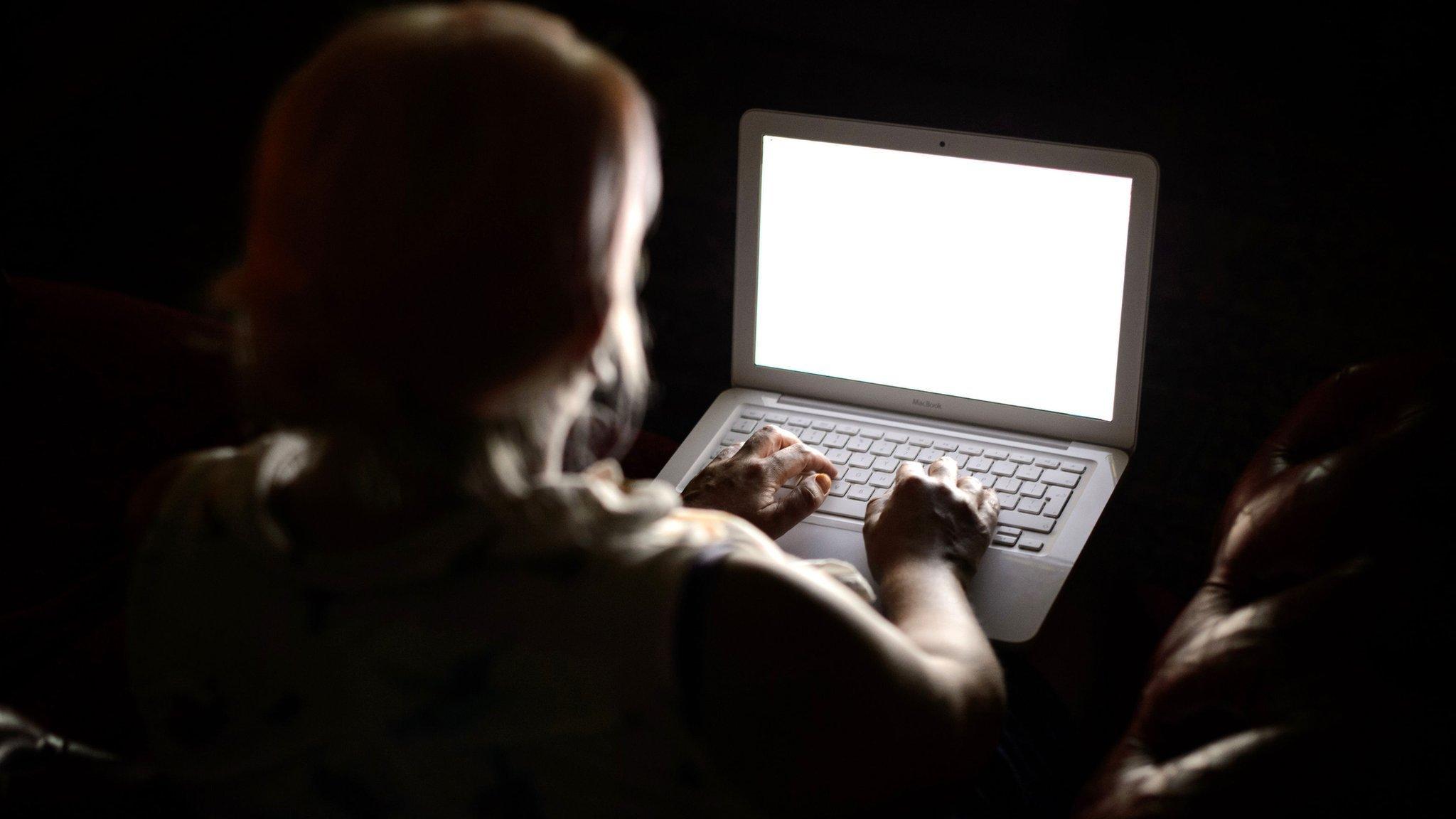 Picture of woman in front of a computer