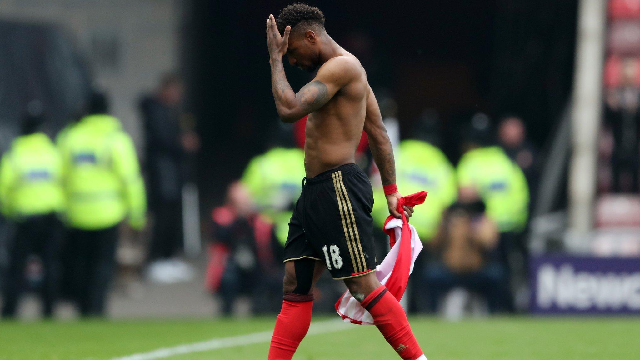 Defoe walks off the pitch