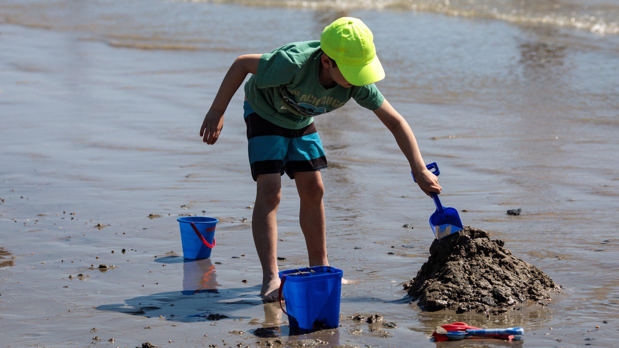 Boy playing on Bognor Regis beach