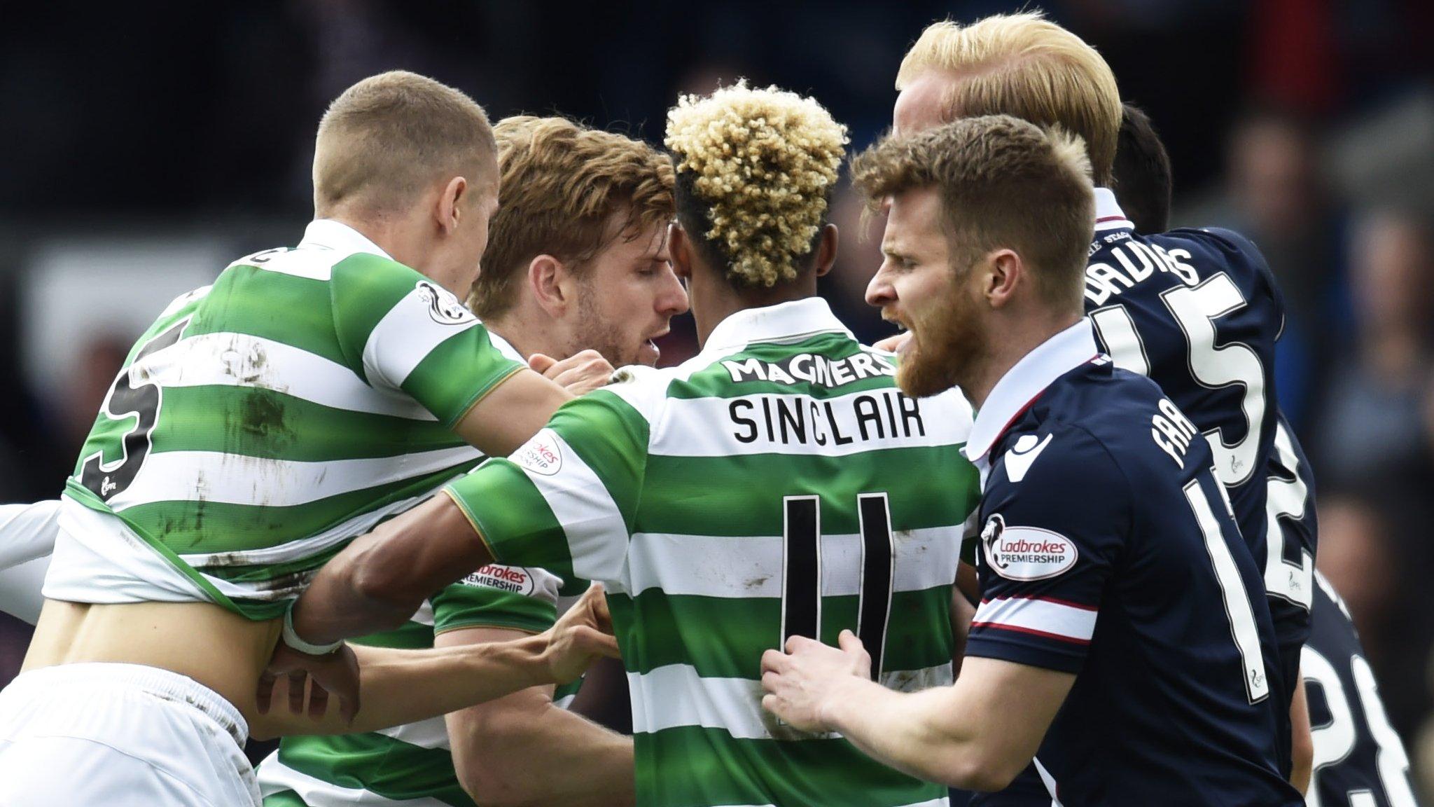 Celtic and Ross County players react after Scott Brown's lunge on Liam Boyce