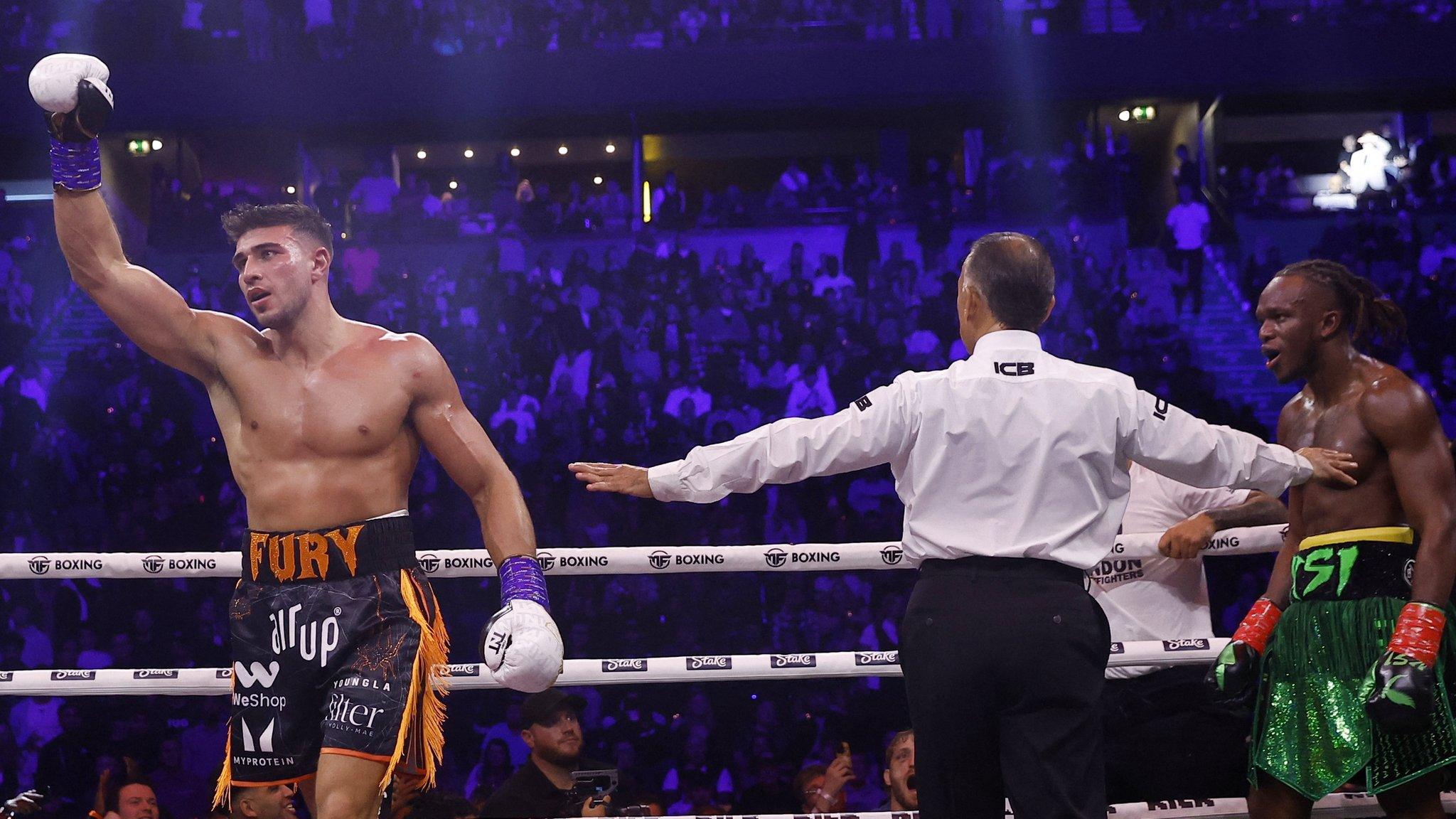 Tommy Fury raises his hands after fight with KSI