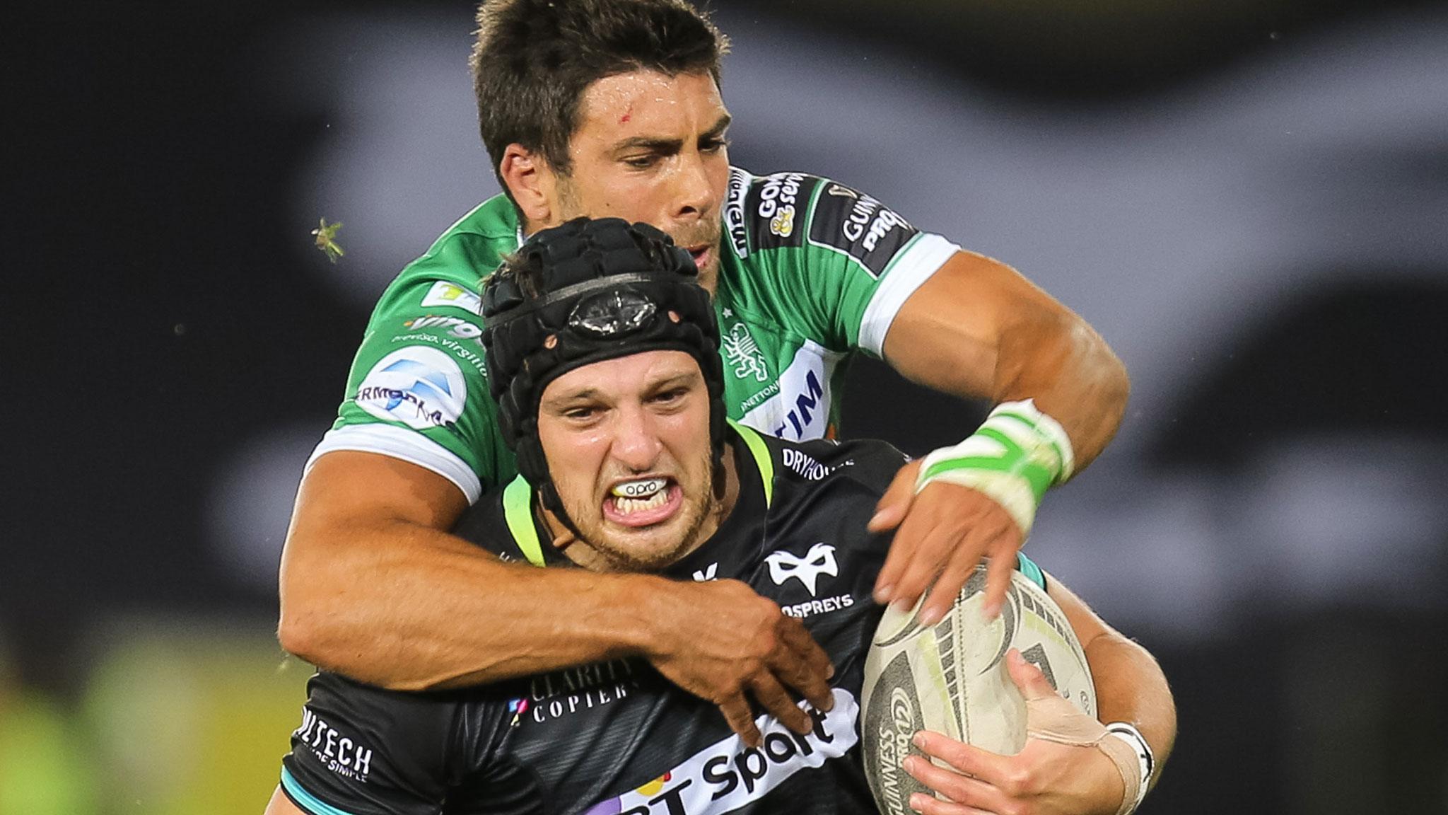 Dan Evans of the Ospreys is tackled