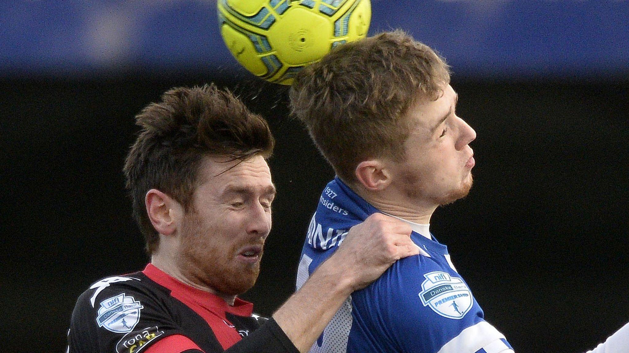 Crusaders' Howard Beverland battles with Coleraine's Jamie McGonigle during the game at the Showgrounds in January