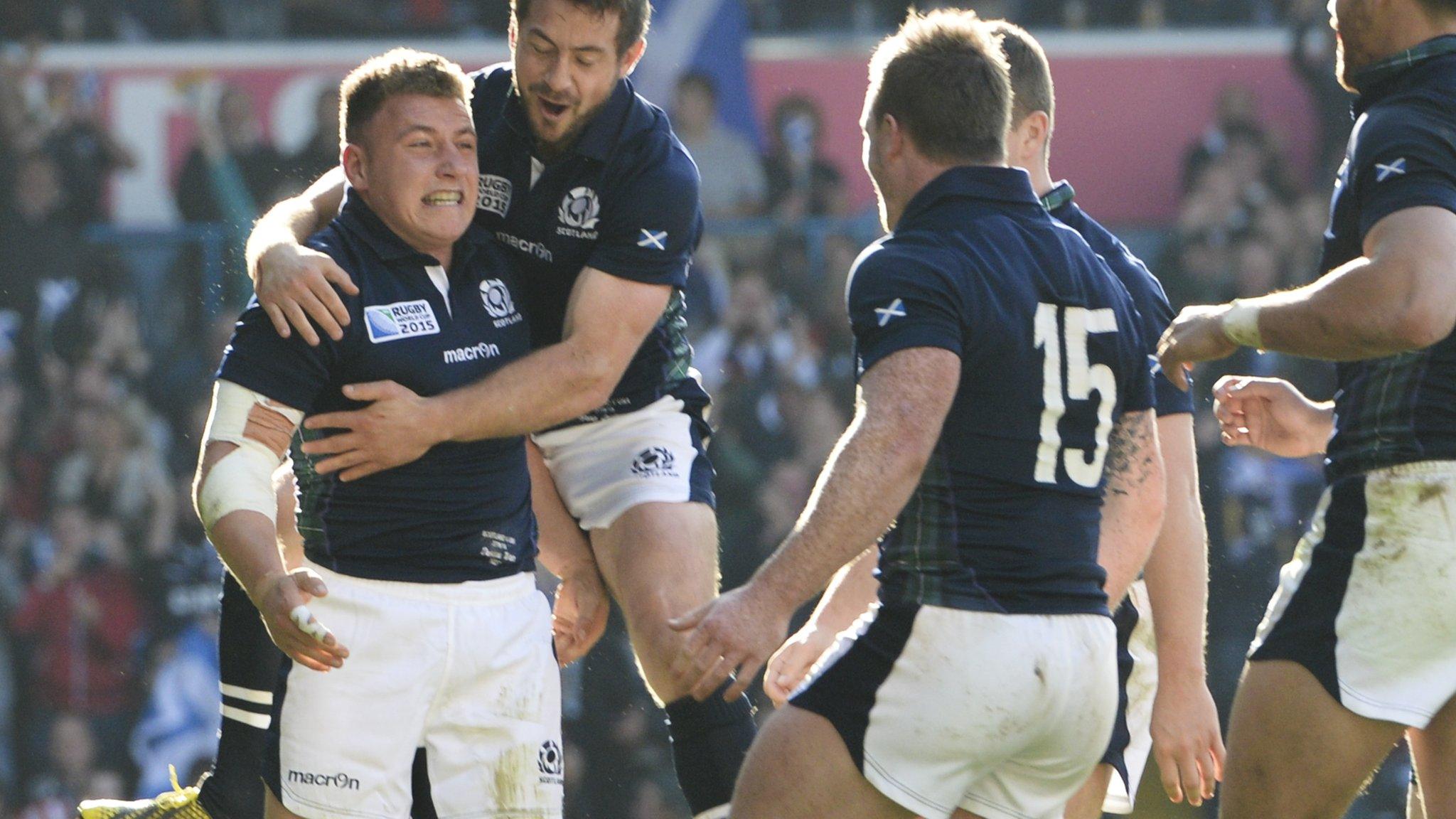 Scotland celebrate Duncan Weir's try against the USA