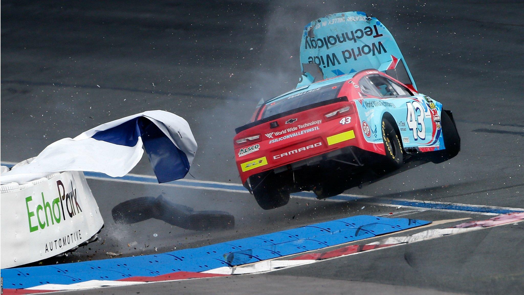 Charlotte, United States, 29 September: Bubba Wallace crashes his World Wide Technology Chevrolet into a tire barrier during practice for the Monster Energy NASCAR Cup Series Bank of America Roval 400 at Charlotte Motor Speedway. (Photo by Brian Lawdermilk/Getty Images)