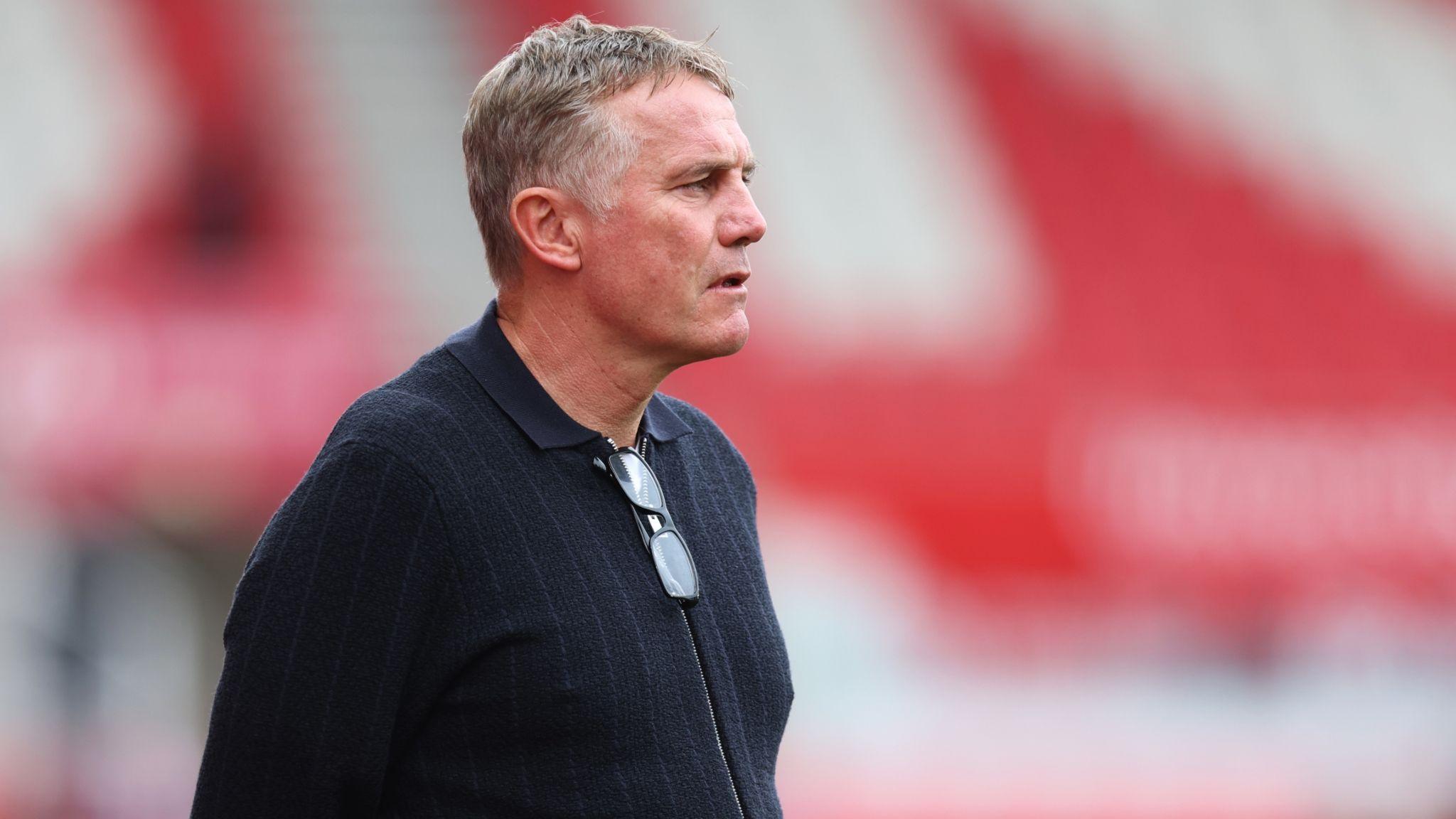 Phil Parkinson watches on from the touchline