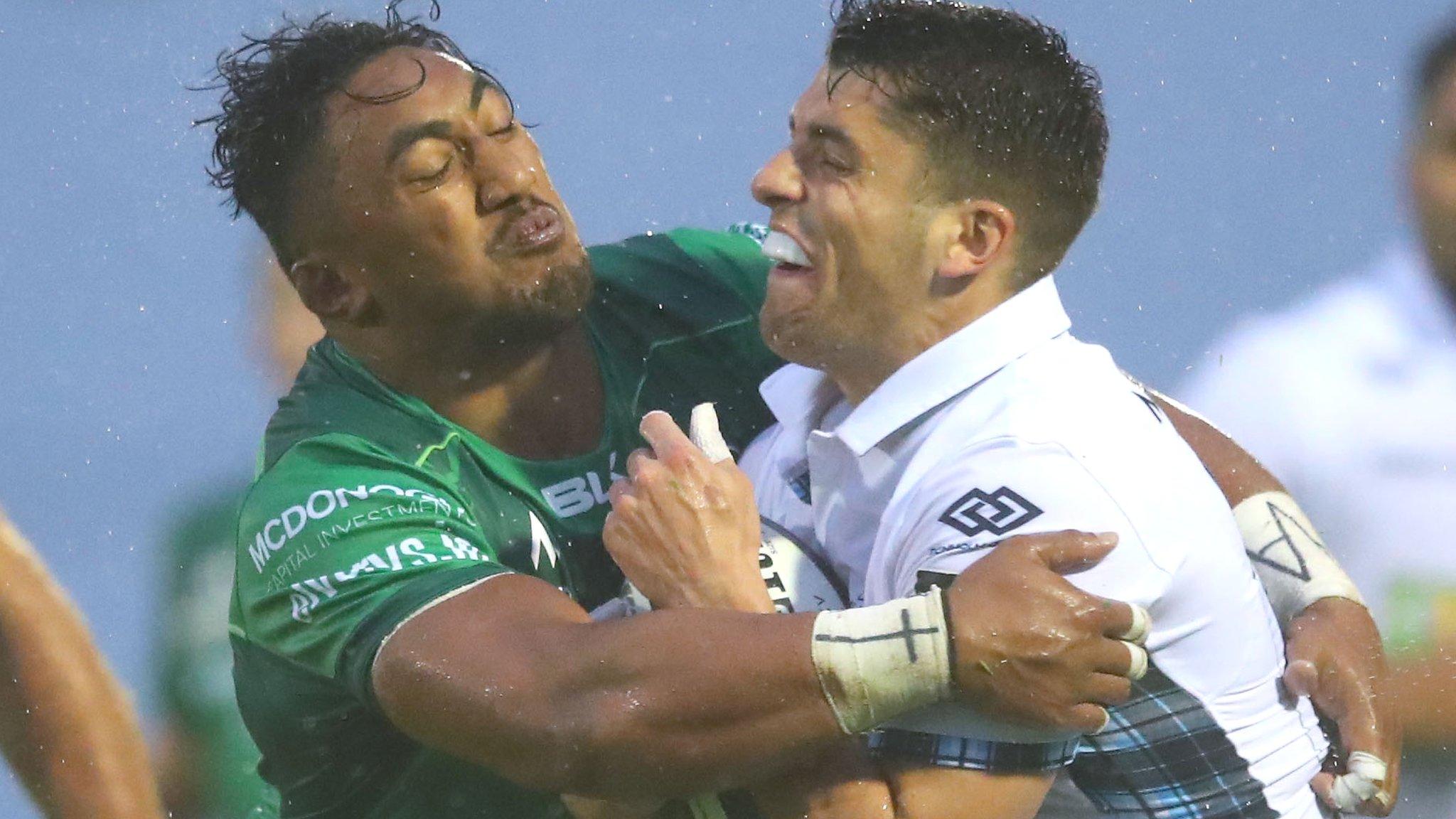 Bundee Aki gets to grips with Glasgow's Adam Hastings in Galway