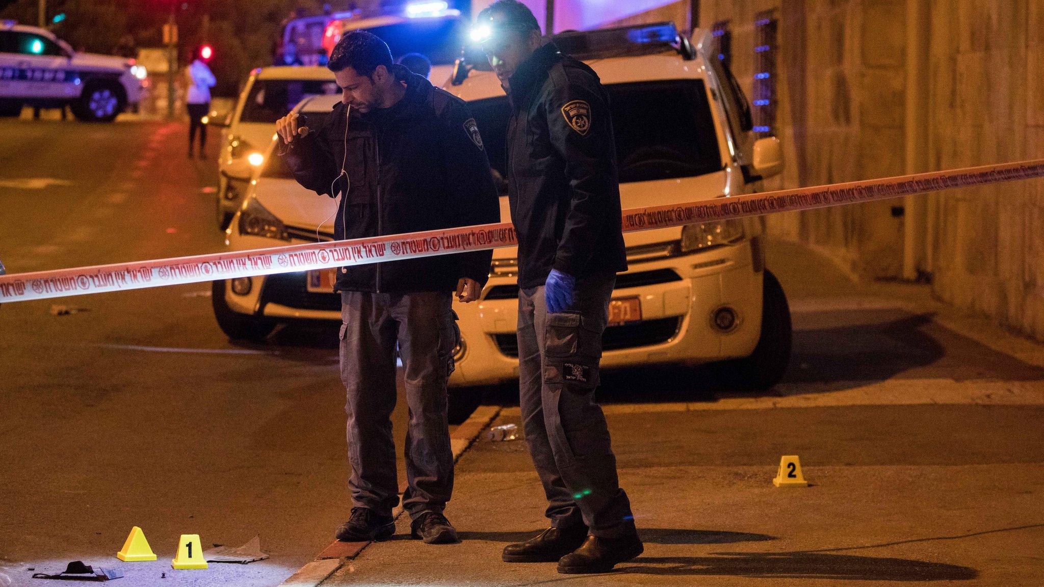 Israeli police inspect the scene of what the Israeli military said was a Palestinian car-ramming attack in Jerusalem (6 February 2020)