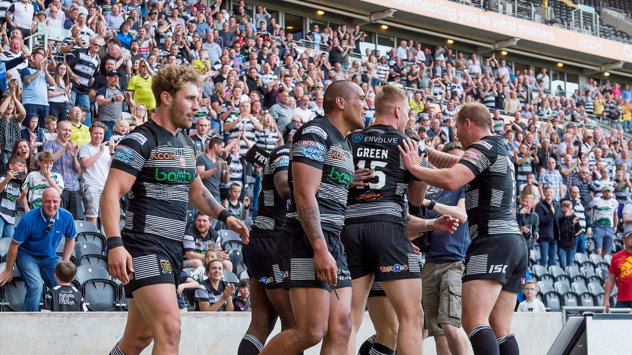 Hull celebrate the last of their six tries against reigning Super League champions