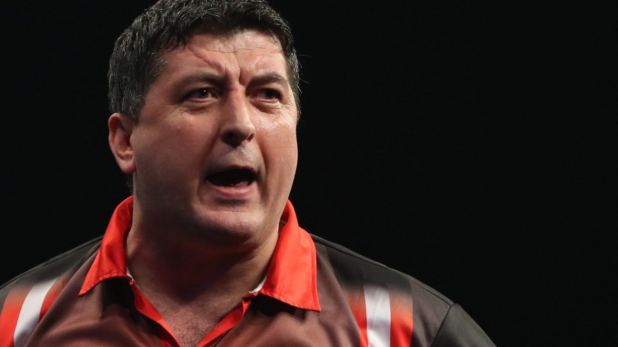Mensur Suljovic celebrates his win over Peter Wright