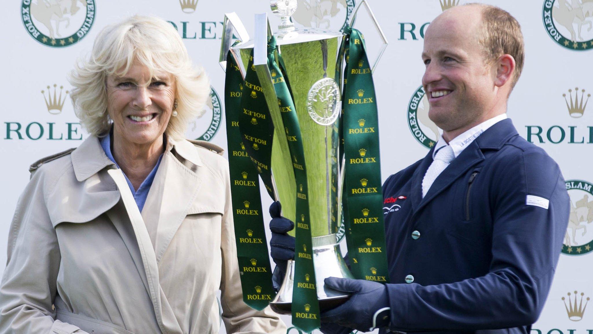 Michael Jung receives the Grand Slam trophy from the Duchess of Cornwall