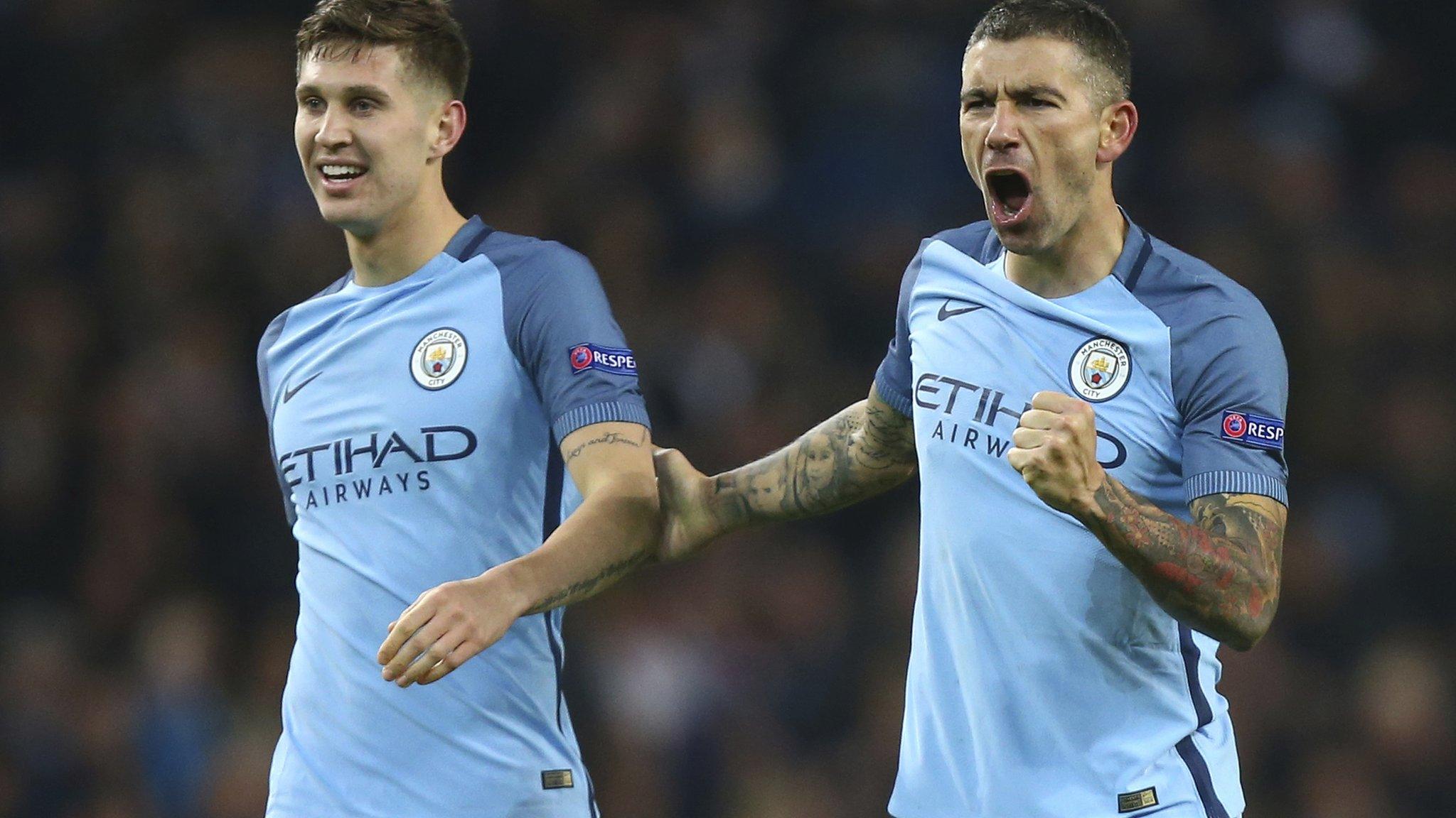 Aleksandar Kolarov and John Stones celebrate